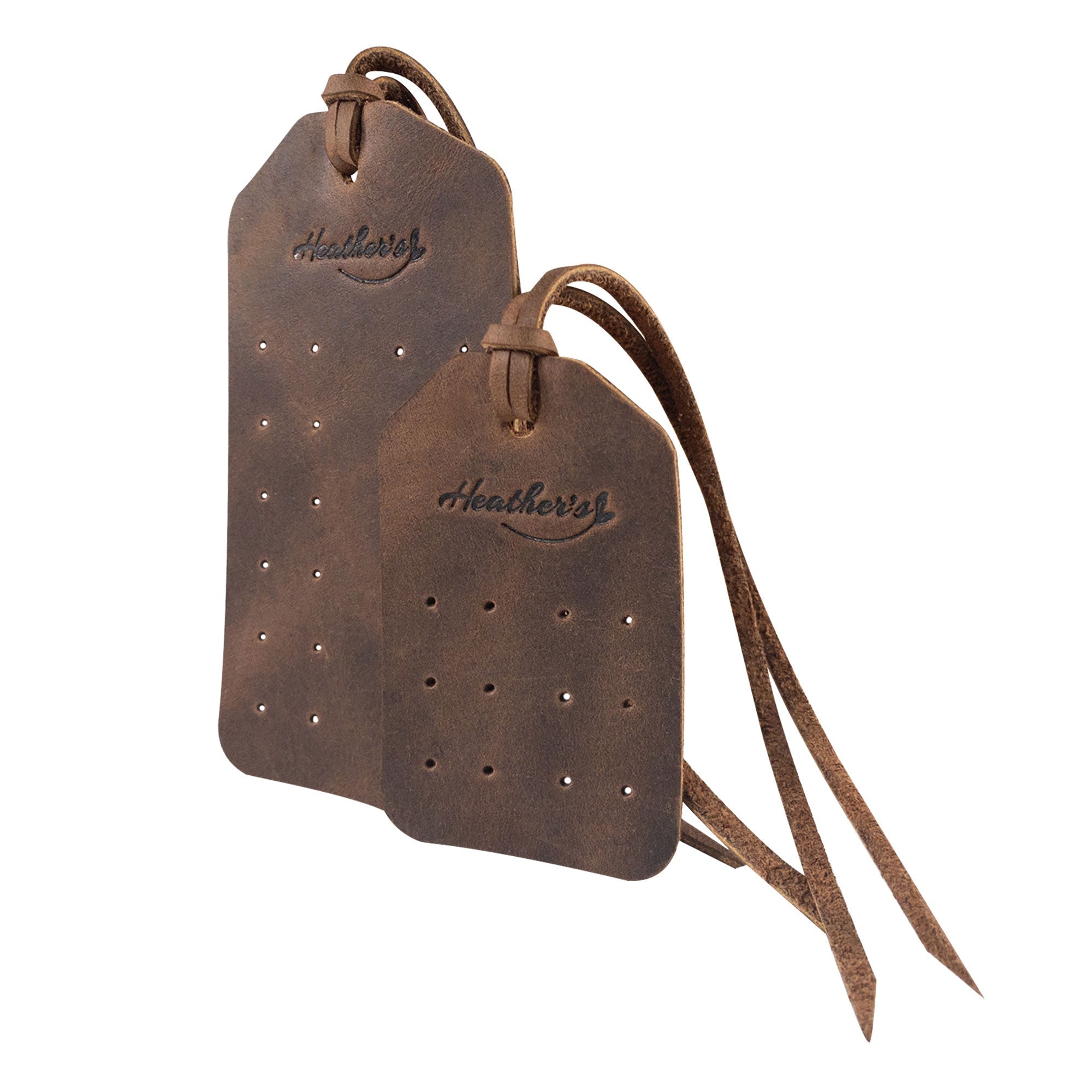 Close-up of Set of 2 Earring Tags by Heather's, highlighting the pre-cut holes and straps on these elegant display tags made from full grain leather. Perfect for organizing earrings at home or while traveling, these artisan-made tags are crafted in La Antigua Guatemala & Oaxaca Mexico.