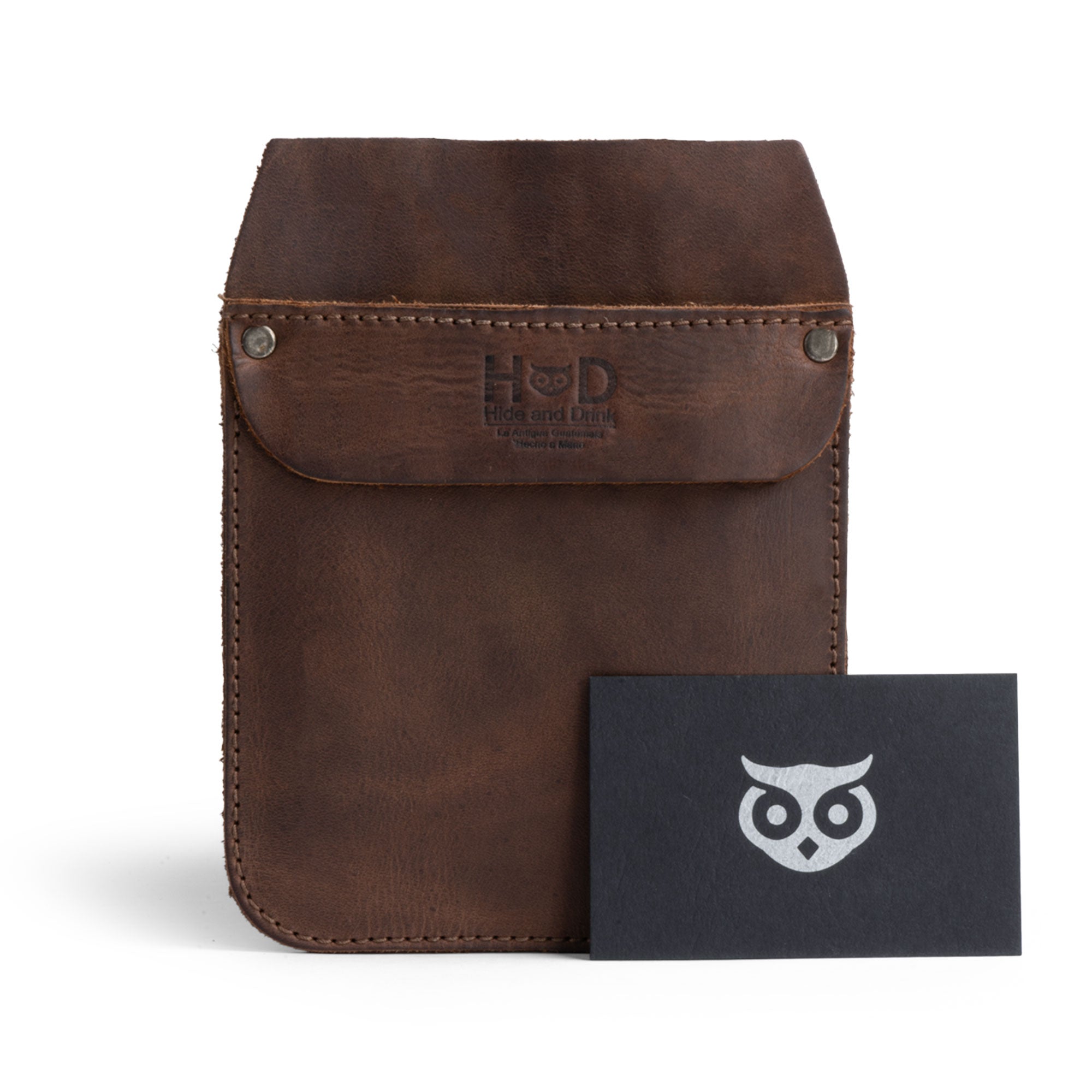 Hide & Drink Leather Work Pocket paired with a business card, highlighting its stylish finish. Perfect for storing pens and tools, this Leather Work Pocket embodies quality craftsmanship, made with artisan skills in La Antigua Guatemala.