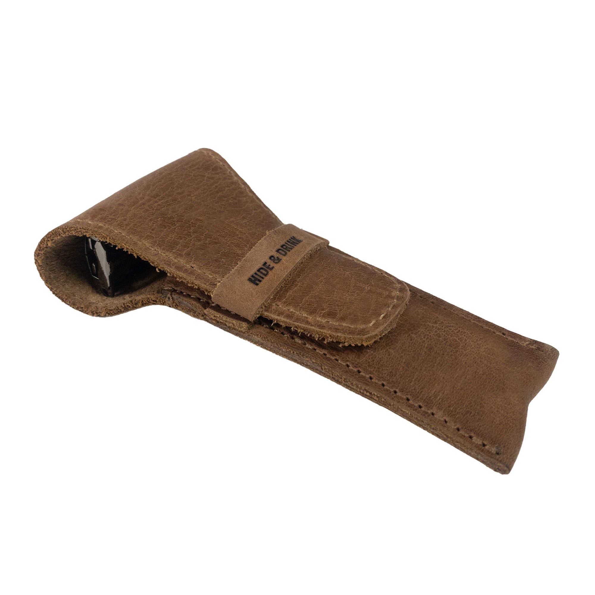 A stylish brown Safety Razor Case by Hide & Drink made from Full Grain Leather, perfect for shaving accessories and personal care. This artisan-crafted case features hand cut and hand sewn details, showcasing quality and durability from La Antigua Guatemala and Oaxaca Mexico.