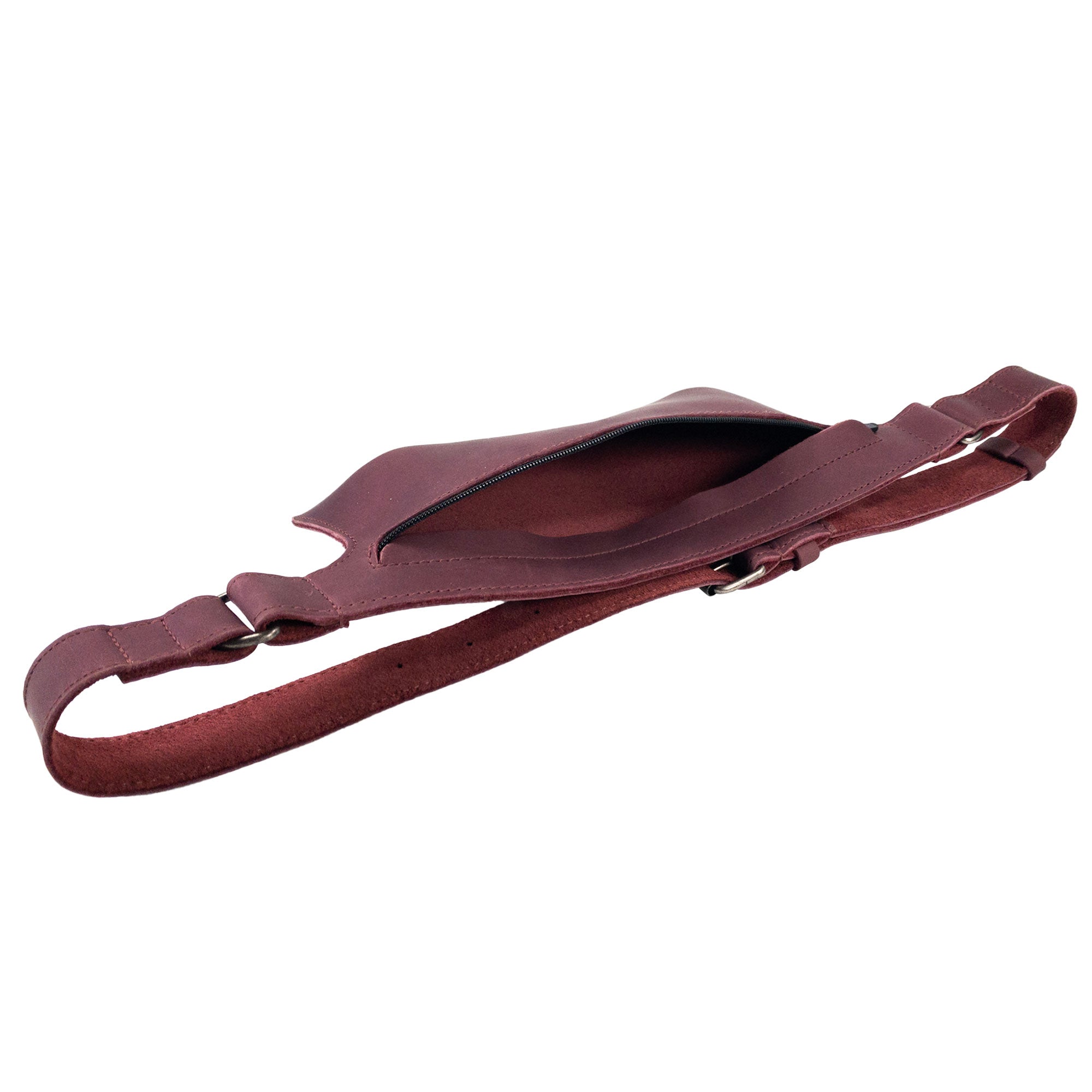 Slim Fanny Pack by Hide & Drink viewed from the side, demonstrating a streamlined profile for easy carry. Made from high-quality full grain leather, this artisan waist bag is perfect for holding small items.