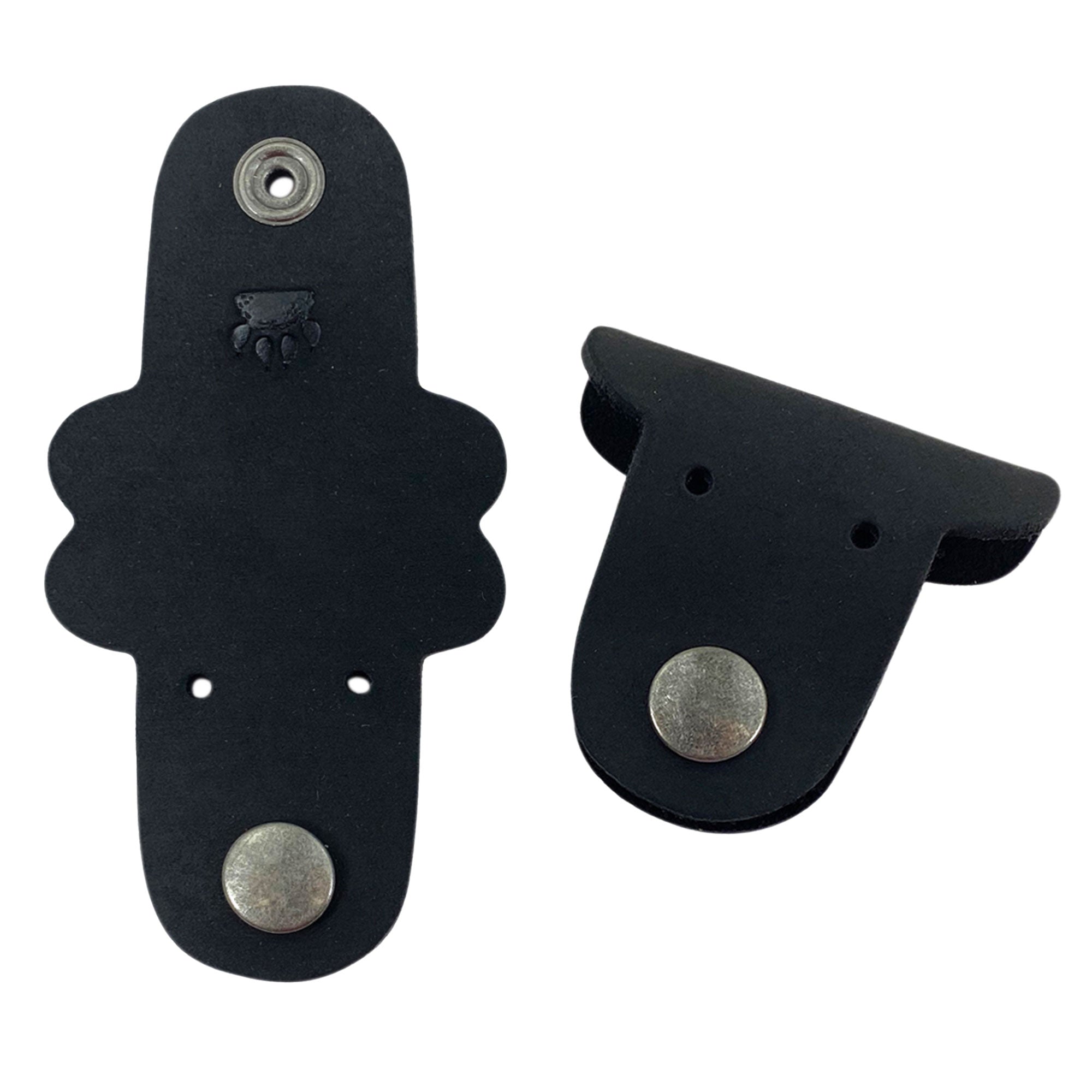 Taco Dog's Dog Cord Keeper in a unique design, ideal for managing your cords while on the go. Made from full grain leather, these accessories clip together for effortless organization of headphones and chargers. Enjoy practical artisan quality from La Antigua Guatemala with this handmade 2 pack.