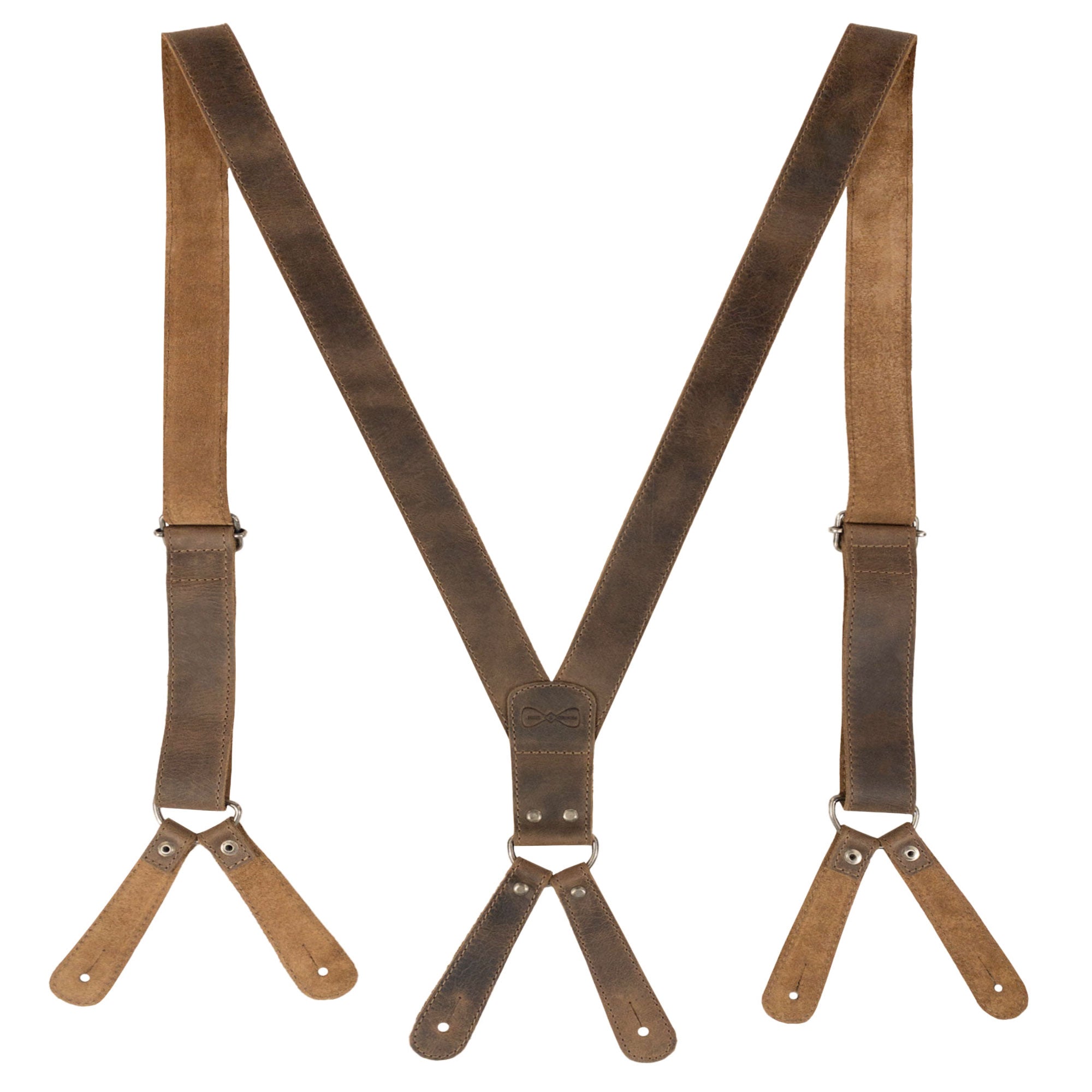 Close-up of Rustic Button End Suspenders by Hide & Groom, displaying high-quality full grain leather and button ends. Ideal for groomsmen, best men, and bachelors attending wedding ceremonies or dinner parties. Each piece is hand cut, hand sewn, and fire branded, reflecting artisan craftsmanship in La Antigua Guatemala & Oaxaca Mexico.
