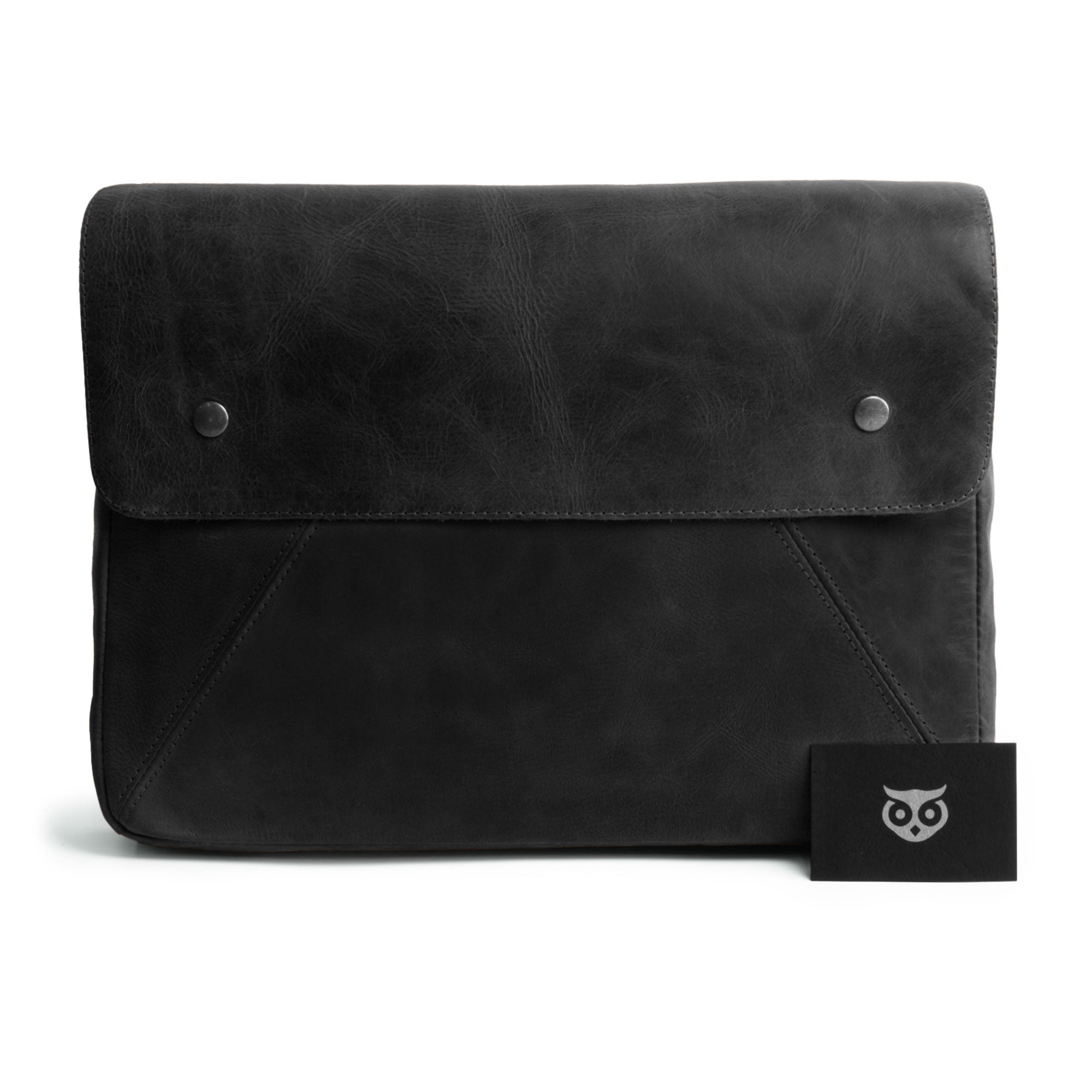 Front view of Hide & Drink's Vintage Folder Holder XL in black leather, showcasing its elegant design and Full Grain Leather texture. A great office accessory, this handmade padfolio is perfect for organizing contracts and documents, created by artisans in La Antigua Guatemala and Oaxaca Mexico.