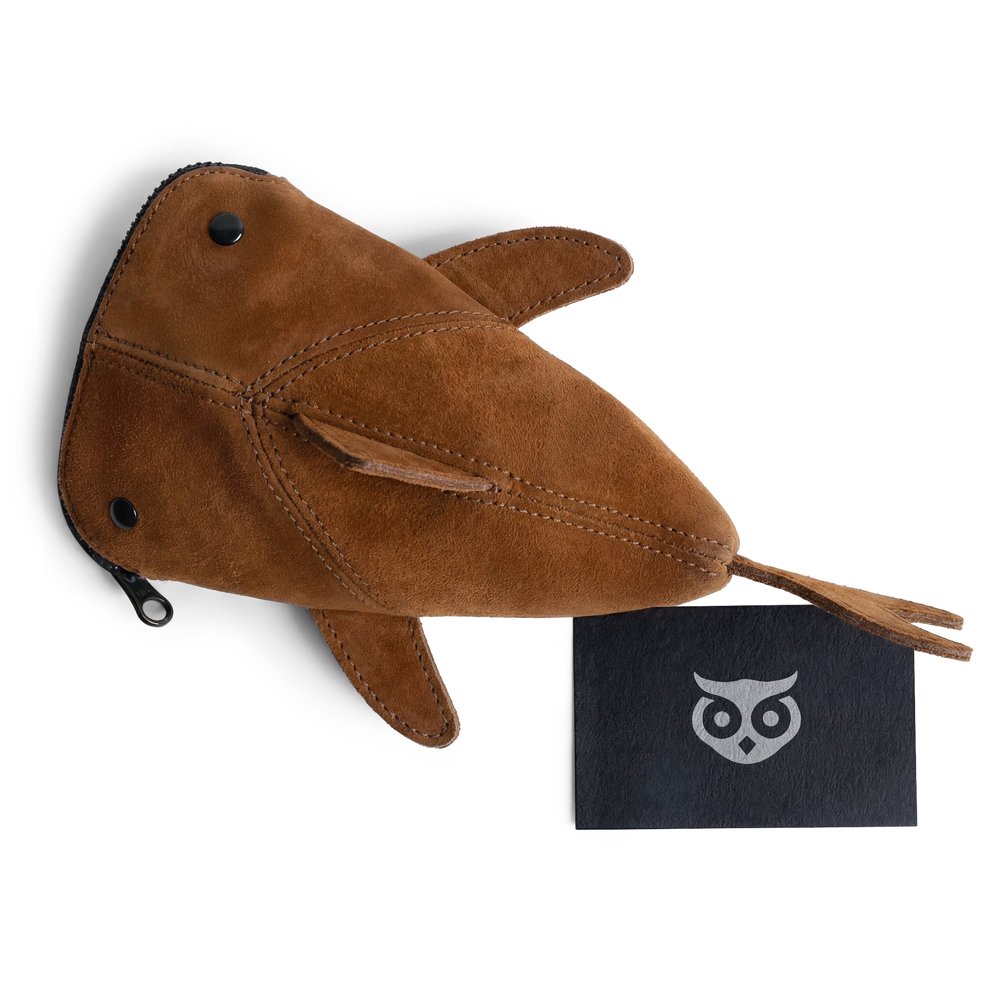 Overview of Hide & Drink Leather Shark Pouch with branded tag, embodying artisan quality and functionality, serving multiple purposes like a wallet or makeup bag, handmade in La Antigua Guatemala and Oaxaca Mexico.