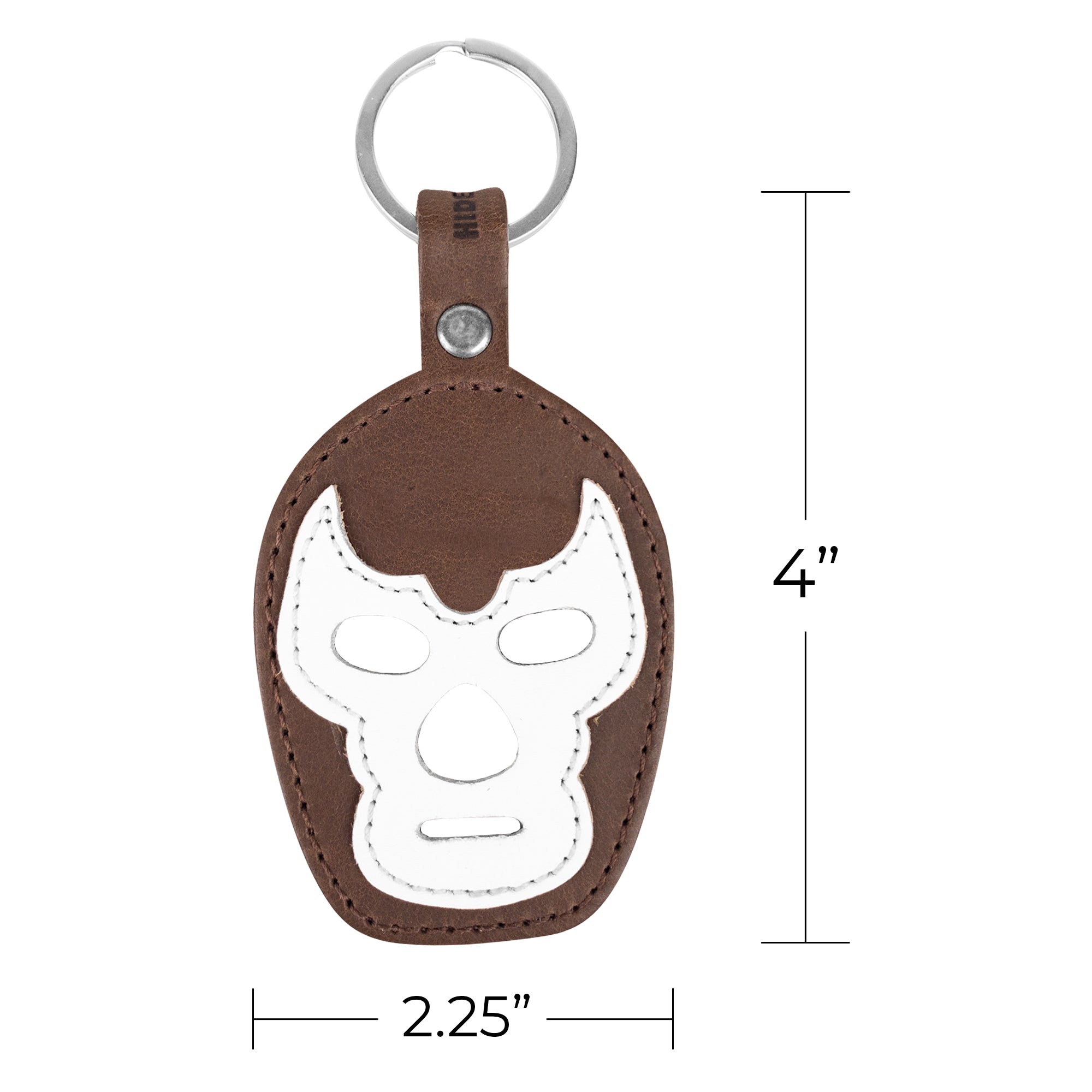 The Luchador Mask Leather Keychain shown with a unique color scheme, ideal as both a keyring and travel accessory. This key organizer from Hide & Drink is crafted from premium full grain leather, showcasing the benefits of small batch production techniques with artisan skill, handmade in La Antigua Guatemala and Oaxaca Mexico.