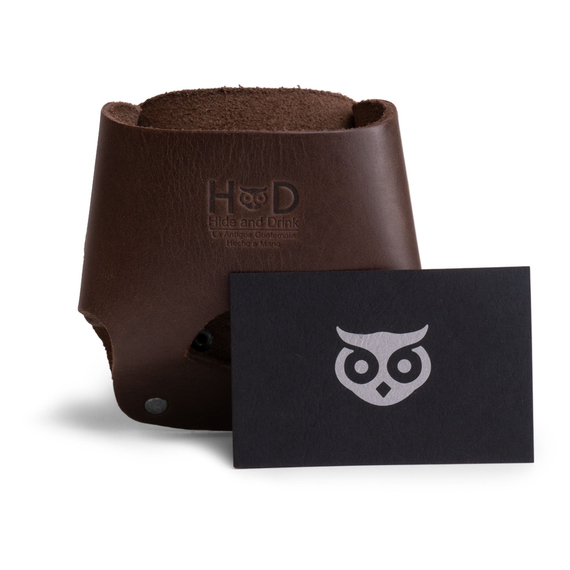Hide & Drink's Large Tape Holster shown with branded card, reinforcing its quality craftsmanship. A handy tool holster for handymen, designed to accommodate a Large Tape Measure comfortably.