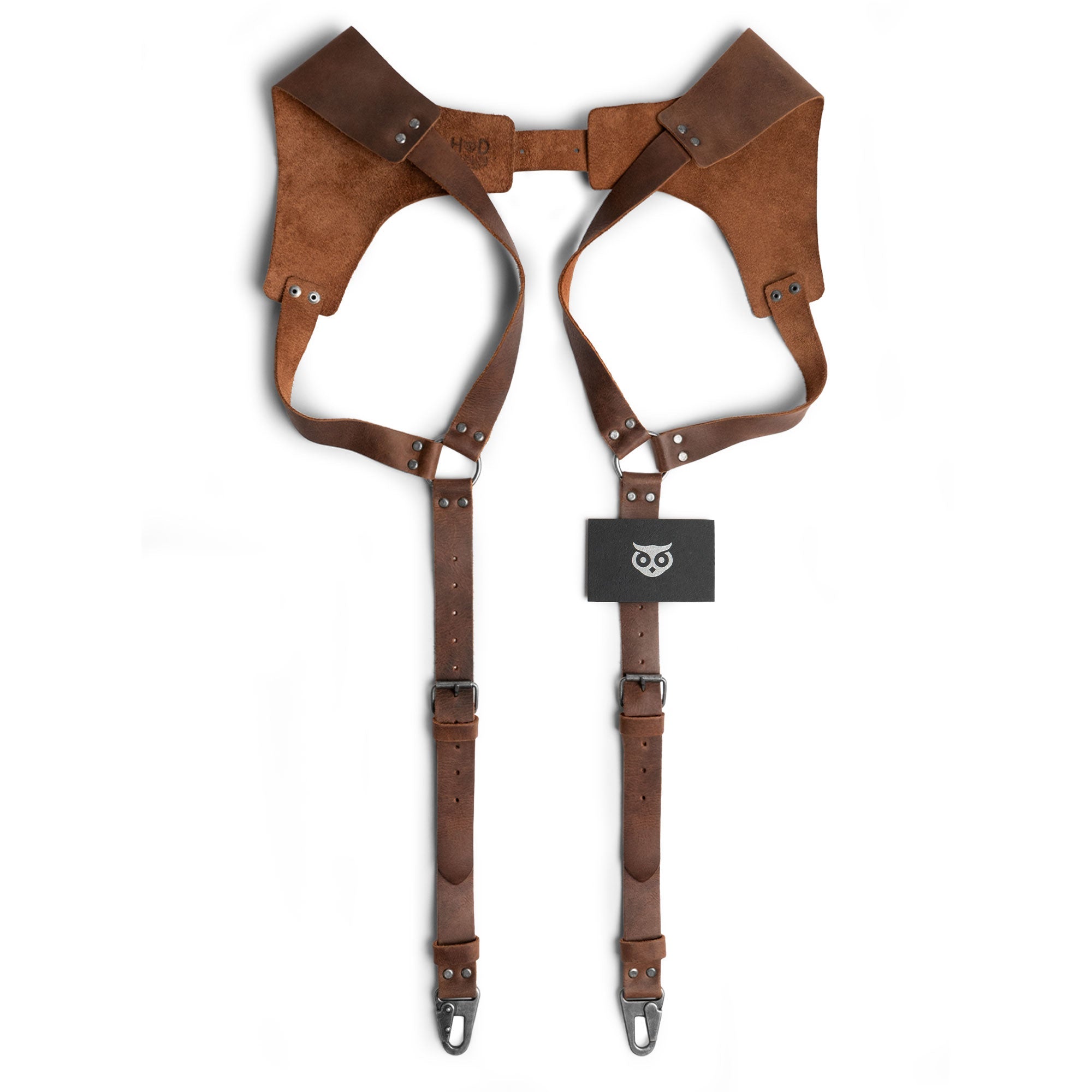 Renaissance Suspenders by Hide & Drink shown with tag, emphasizing the artisan craftsmanship. Designed as back support harness for men, these full grain leather suspenders are perfect for groomsmen, featuring small batch production.