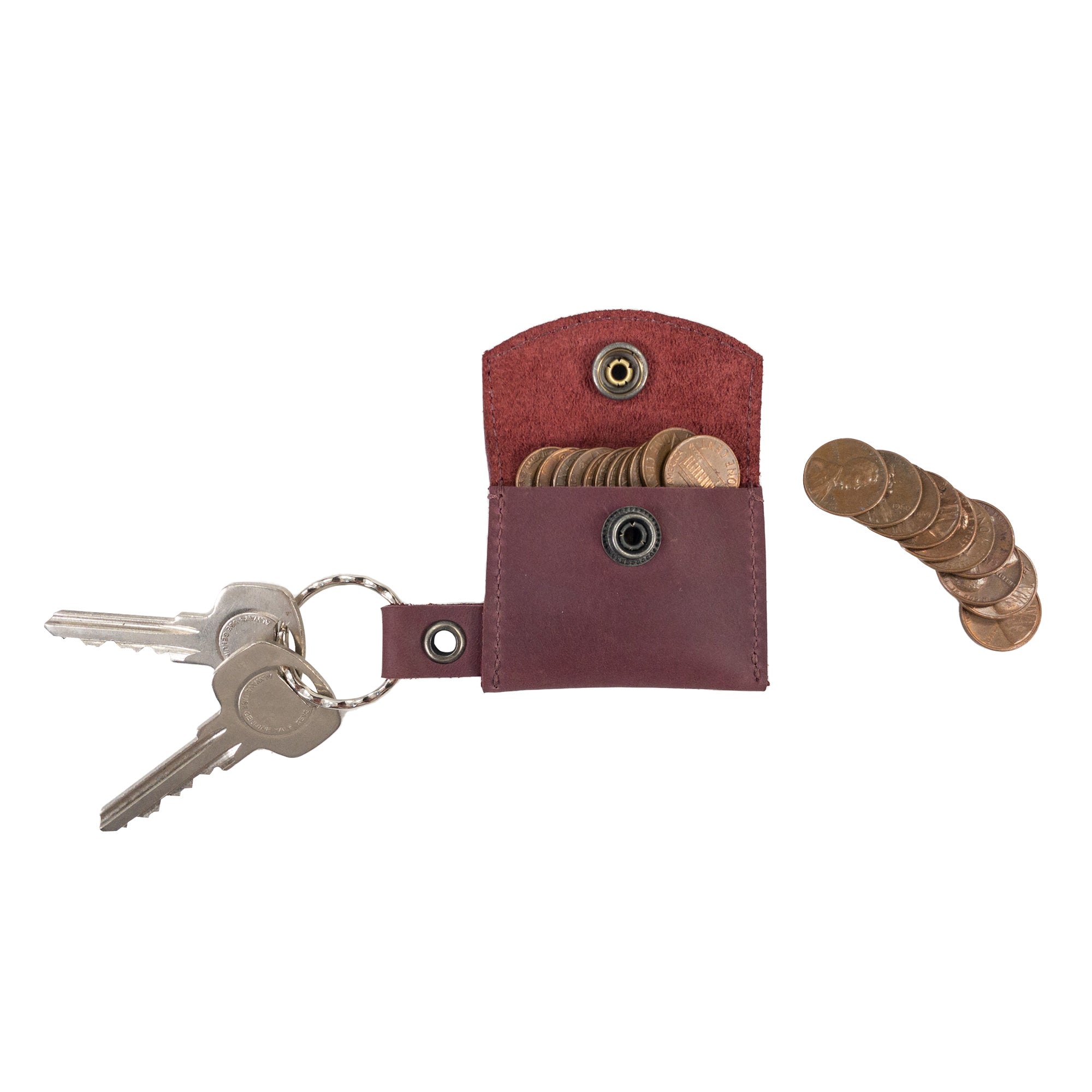 The Tiny Coin Holder Keychain by Hide & Drink, demonstrating its versatility as a keychain and coin holder. Made from Full Grain Leather, this Tiny Coin Holder truly reflects small batch production values and artisan craftsmanship.