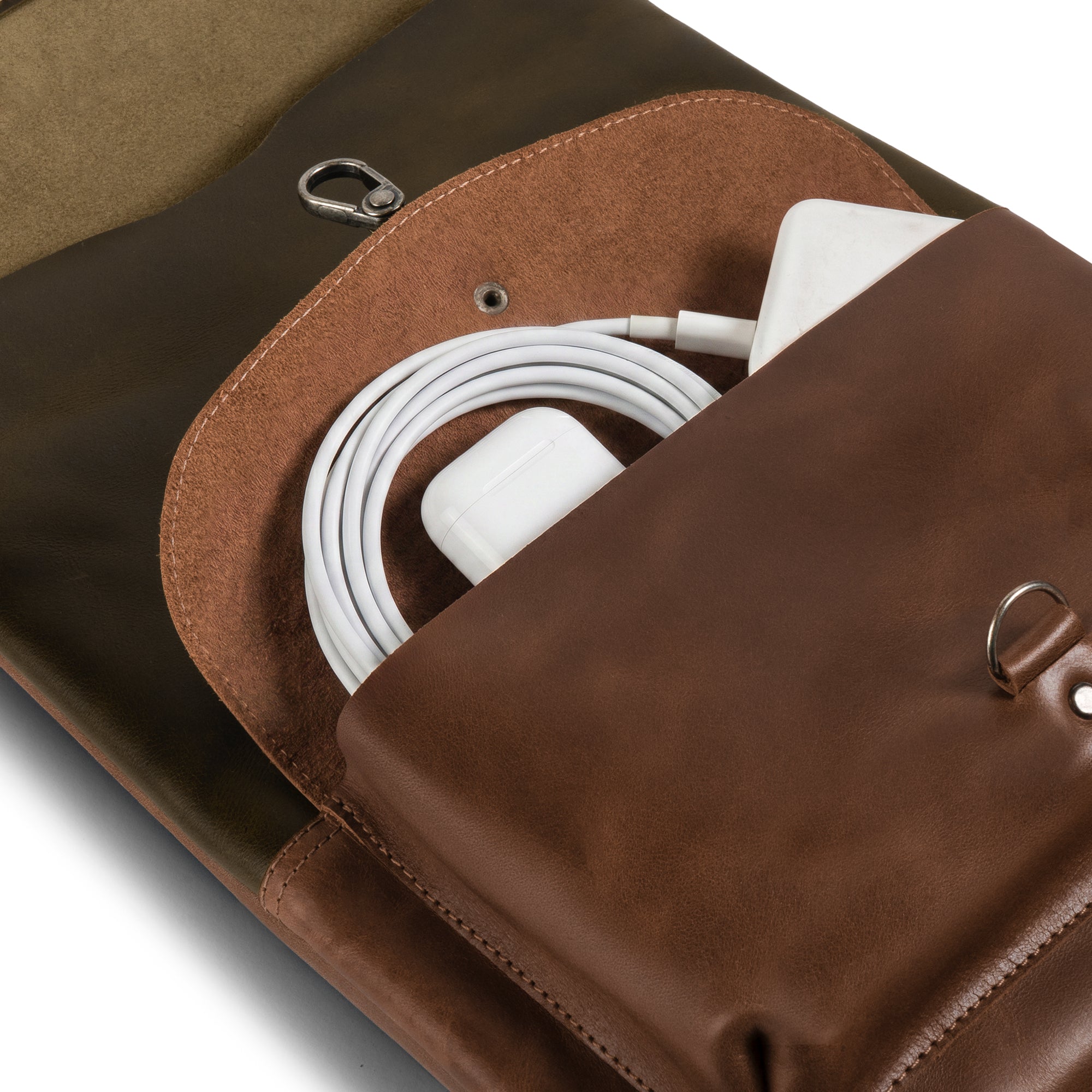 Detail shot of the Adventurer Laptop Bag by Littlefield Chicago, showing the interior pocket designed for holding chargers and cables securely. This artisan-made case is perfect for your laptop travel needs. Leather Adventurer Laptop Case, Extra Bag for Charger and Cables, Hanging Bag for Computer, Rustic Cover, Travel Accessories, Full Grain Leather, Small Batch Production, Hand Cut, Hand Sewn, Artisan, Handmade in La Antigua Guatemala & Oaxaca Mexico.