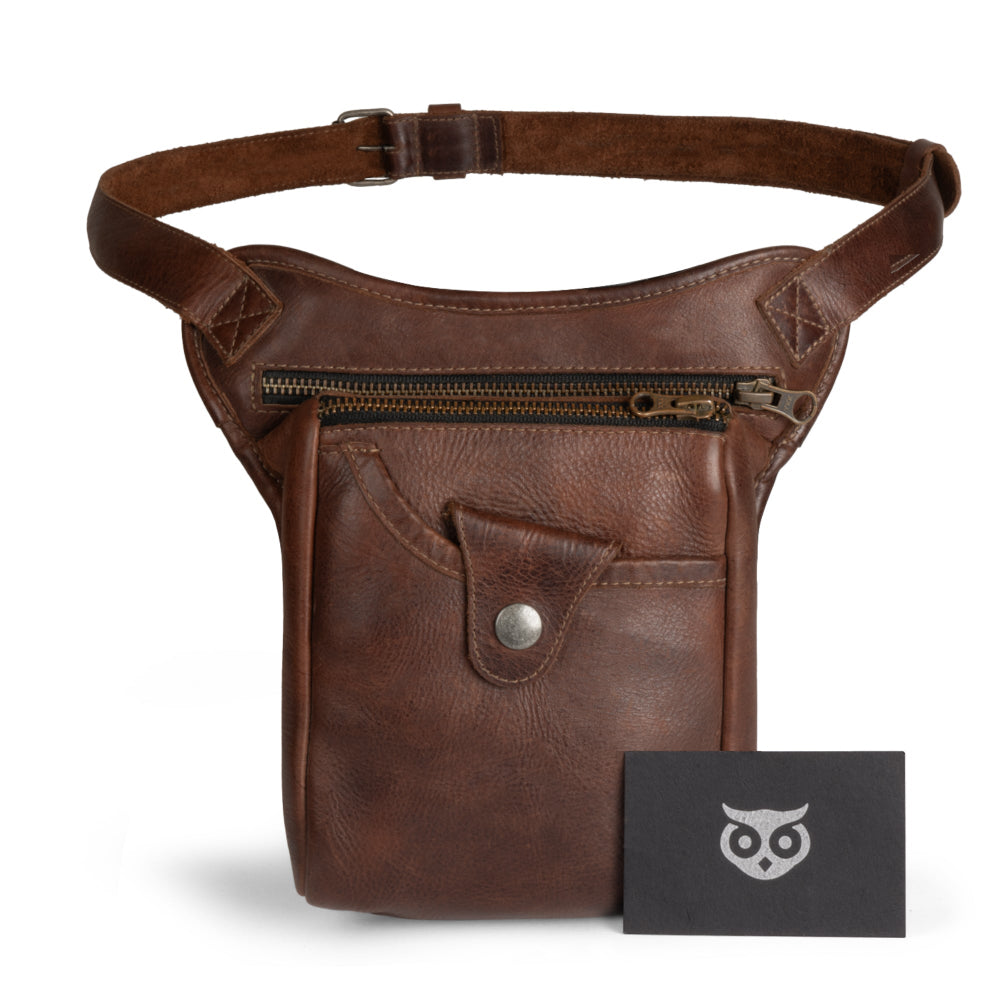 Essential Waist Bag by Hide & Drink, highlighting an adjustable belt and sleek design with dimensions for optimal carry, made from robust full grain leather. Ideal for organizing and storing valuables, this bag reflects the integrity of small batch production, hand cut, and hand sewn by artisans in La Antigua Guatemala & Oaxaca Mexico.