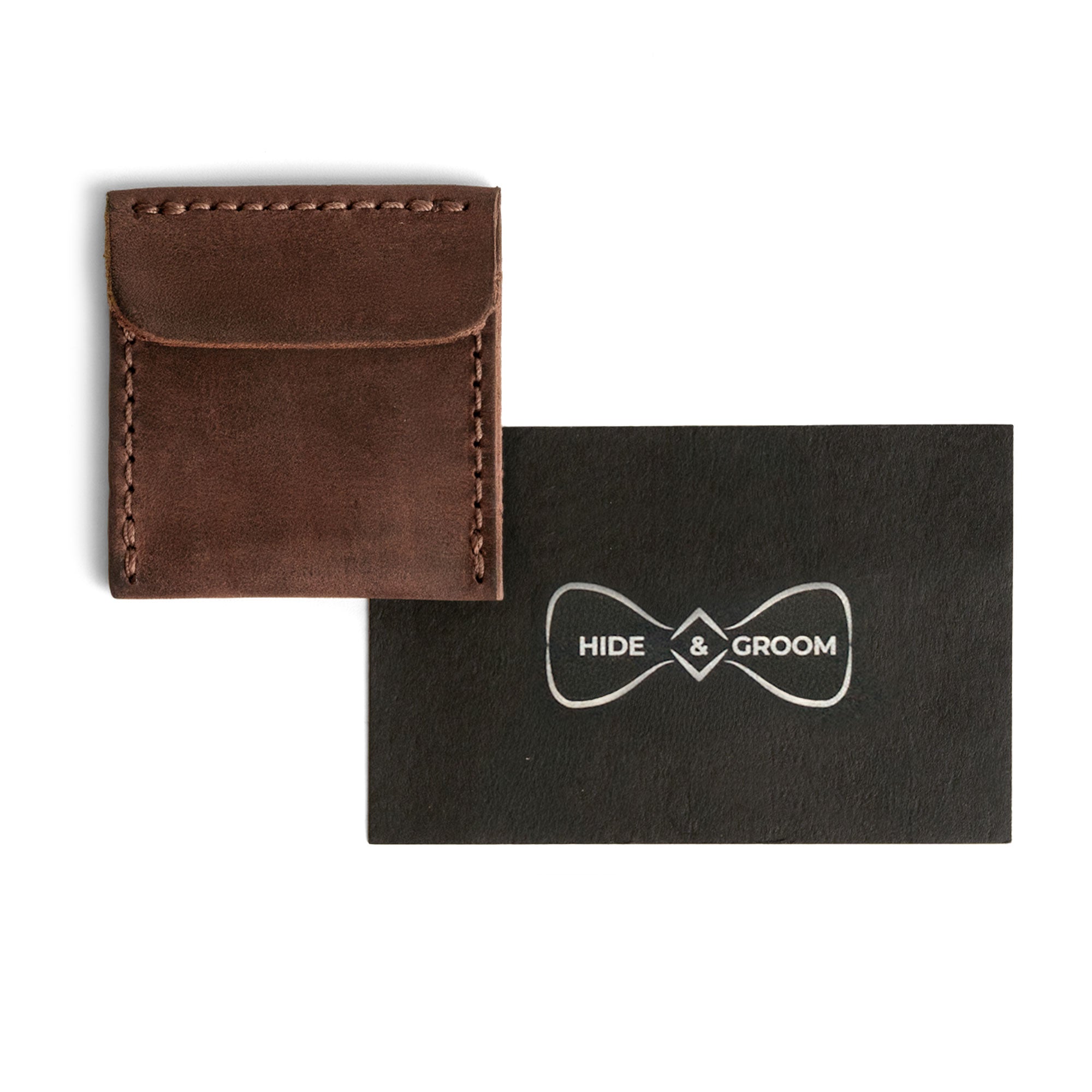 Sophisticated Wedding Ring Case by Hide & Groom, with a sleek Full Grain Leather design. This artisan-made item features small batch production, hand cut and hand sewn details, complete with fire branding, making it a perfect accompaniment for your wedding ring.