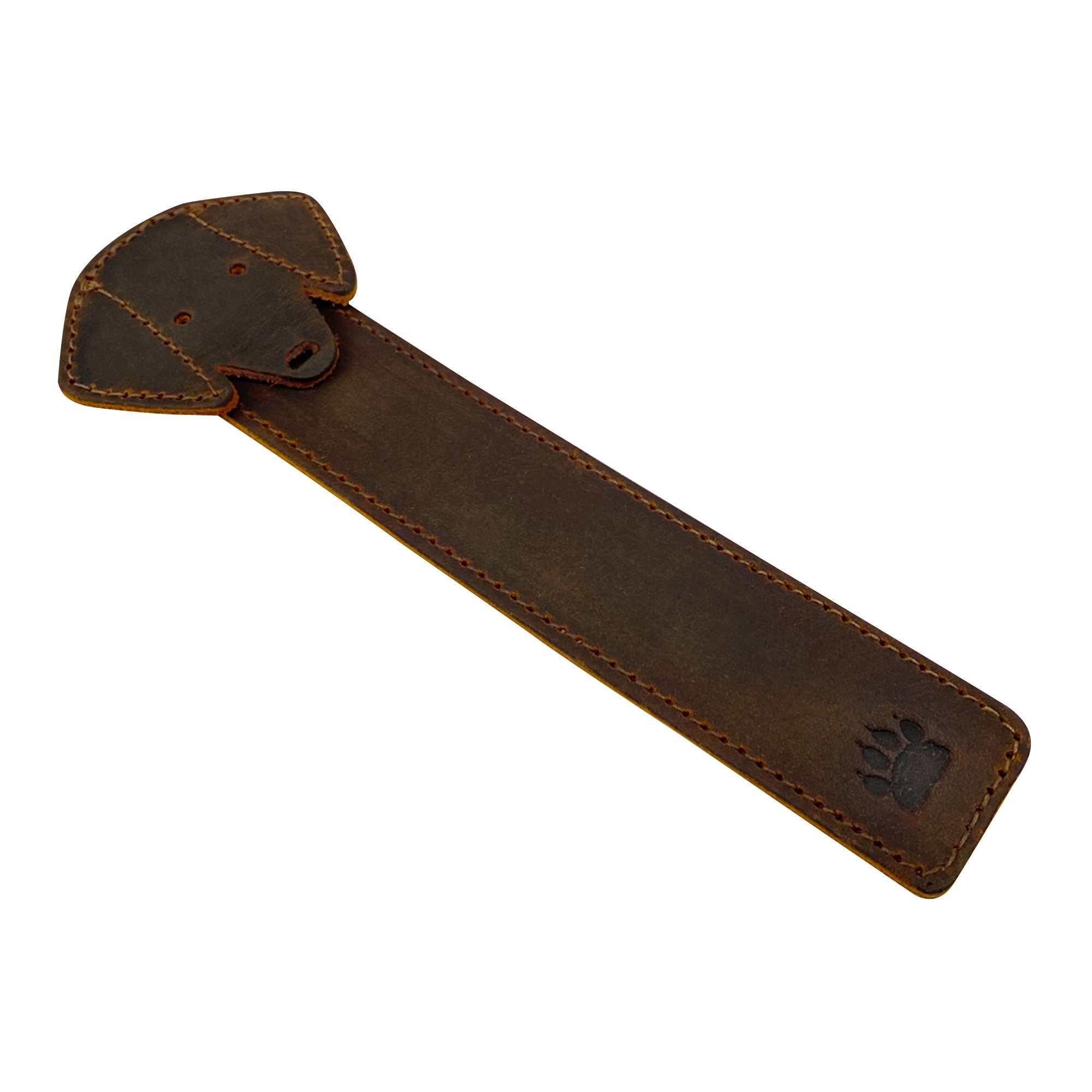 Taco Dog Dog Bookmark displayed on a table, emphasizing its cute dog head design and durable construction. This rustic colored full grain leather bookmark is an exceptional gift for dog and book lovers, created with artisan techniques in La Antigua Guatemala.