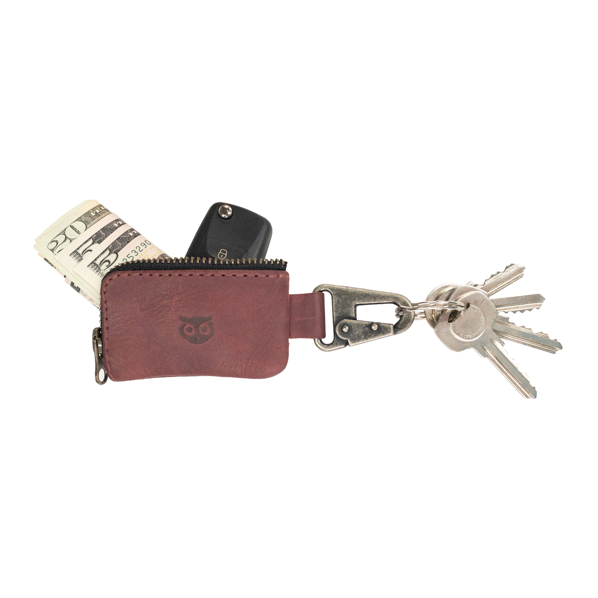 Car Key Holder by Hide & Drink, perfectly designed to organize keys and cash, along with functionality for Headphone and charging Cables, Memory Cards, and Flash Drives. This durable case with a Nickel Metal Clasp is made of Full Grain Leather, showcasing the craftsmanship from Small Batch Production in La Antigua Guatemala & Oaxaca Mexico.