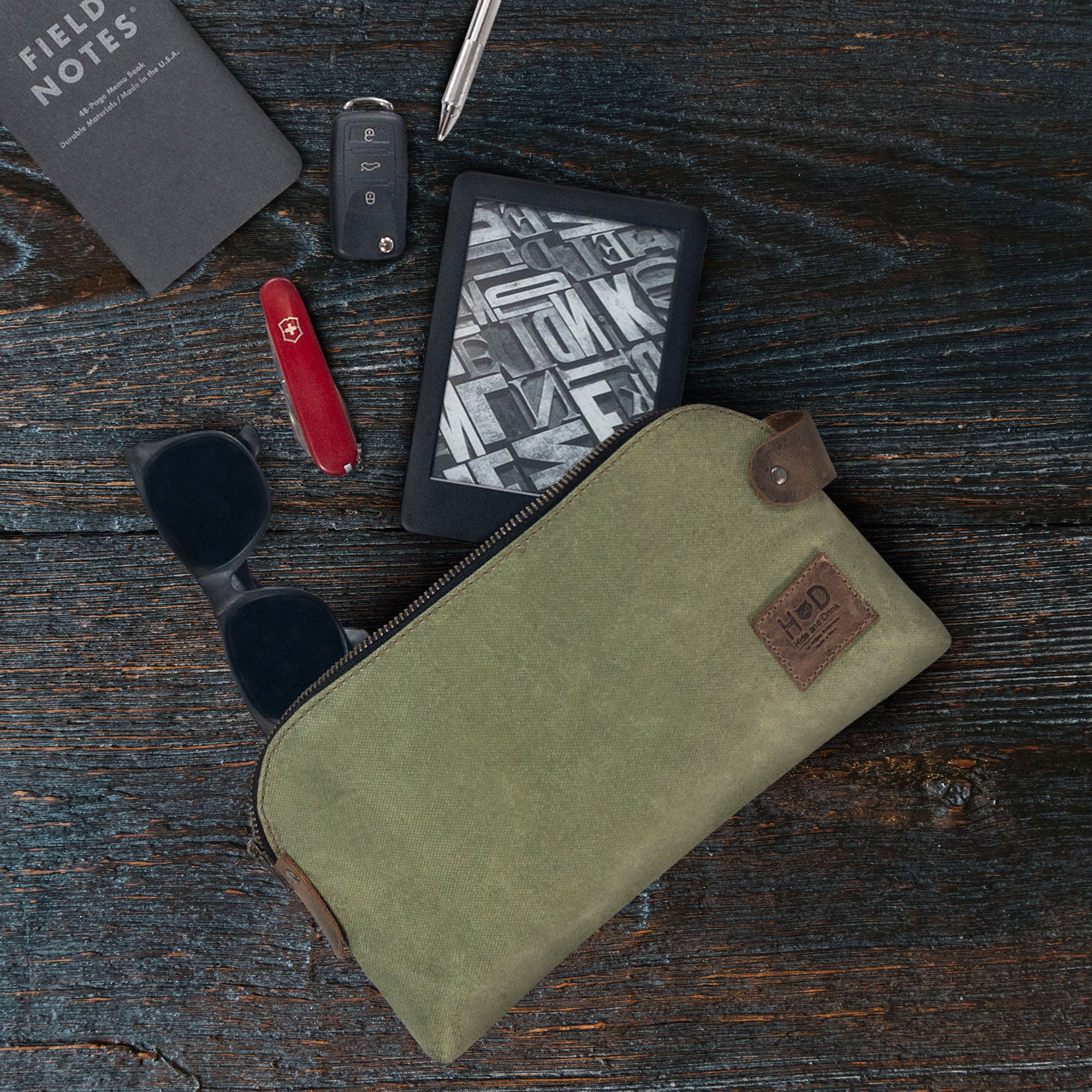 Dopp Kit Utility Bag by Hide & Drink illustrating its functionality in a wide array of settings. This artisan Dopp Kit Utility Bag is made from full grain leather and emphasizes small batch production and artisan craftsmanship with quality hand cut and hand sewn techniques, handmade in La Antigua Guatemala & Oaxaca Mexico.