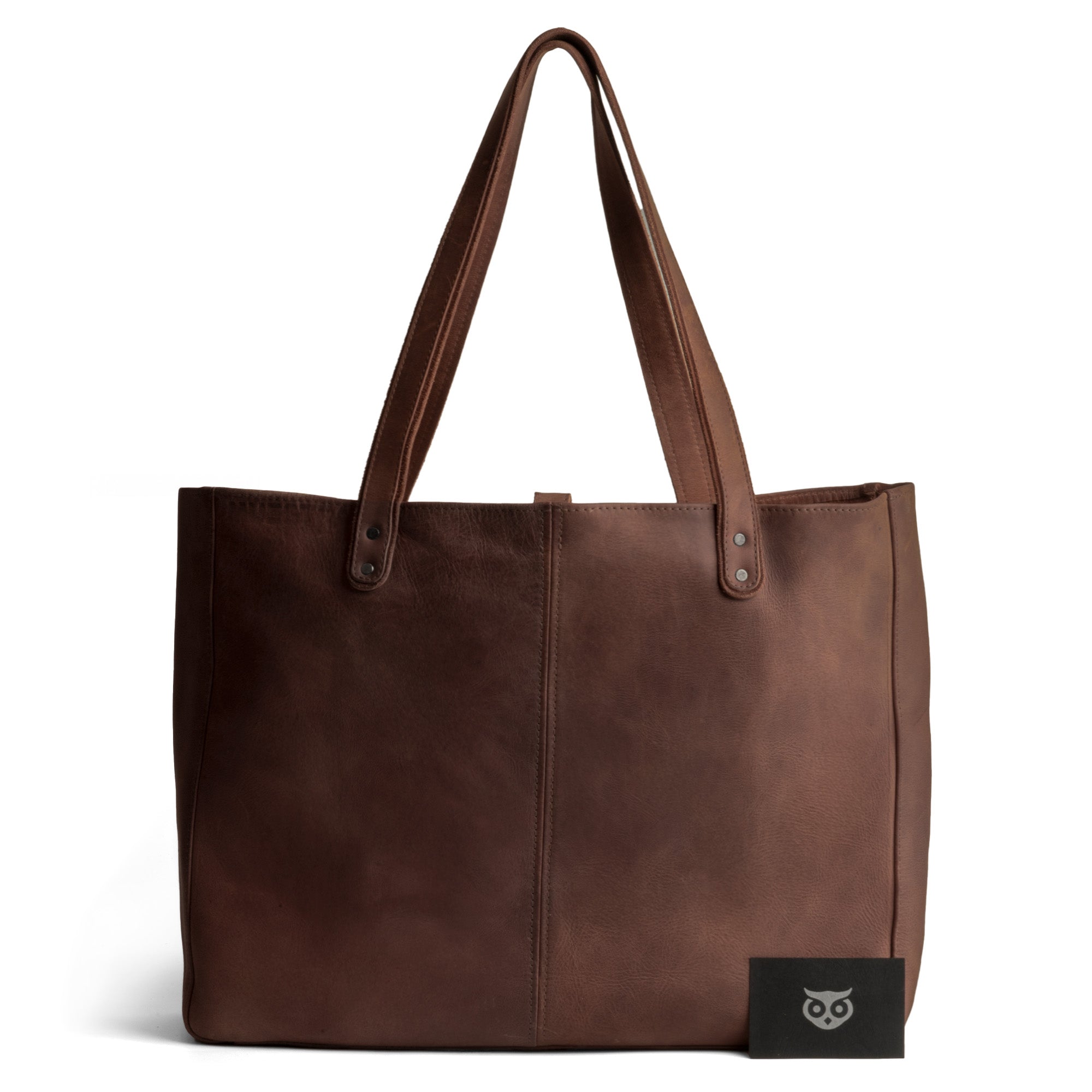 Beautifully handcrafted Formal Tote Bag by Hide & Drink displayed against a white backdrop, emphasizing its elegant design and soft full grain leather texture. This versatile handbag is perfect for women seeking a large shoulder bag for work or casual outings, combining practicality with artisan quality.