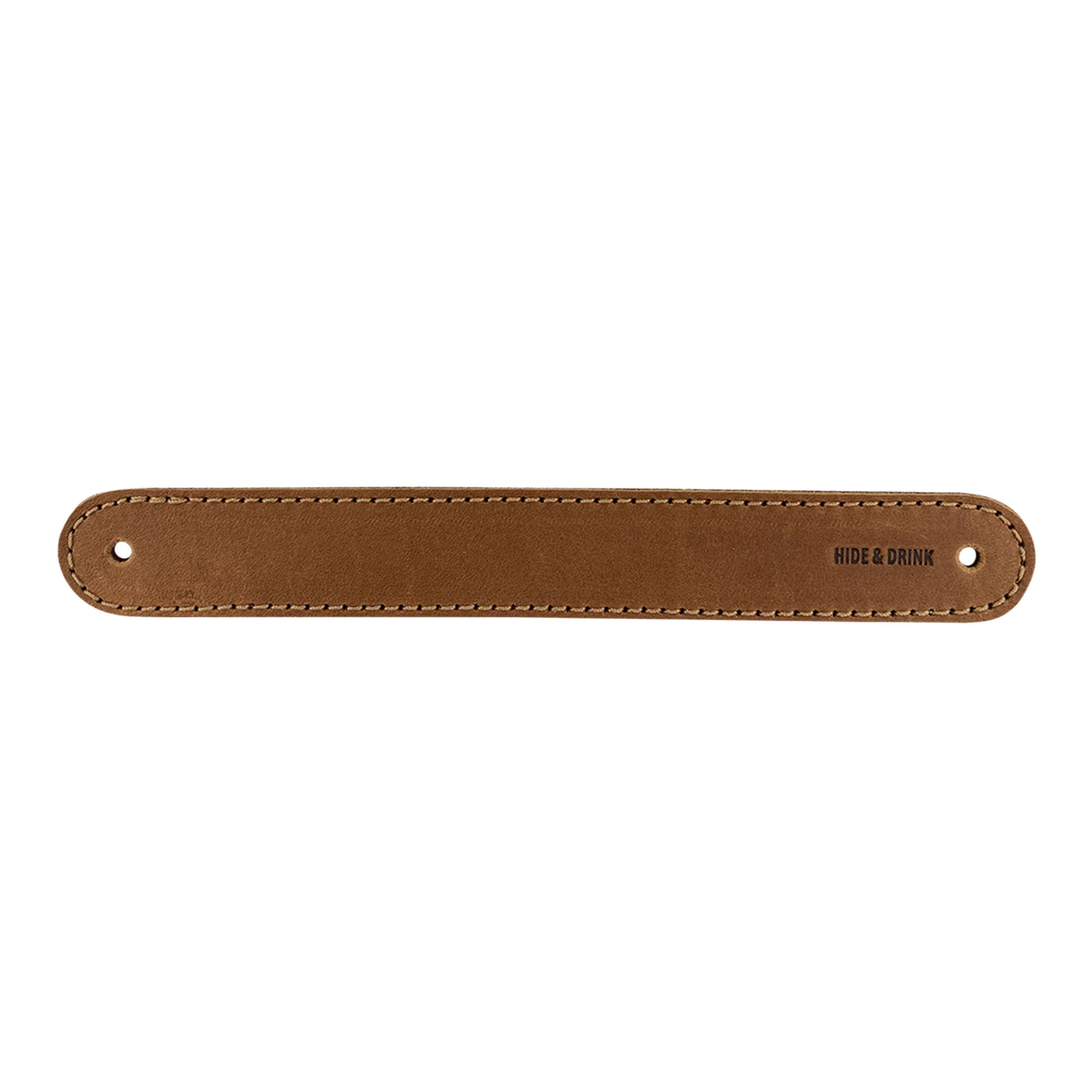 Hide & Drink Drawer Handles (4pk) showcasing a pair of leather handles with the brand logo. Durable, easy to install, and perfect for adding style to your furniture, crafted in La Antigua Guatemala.