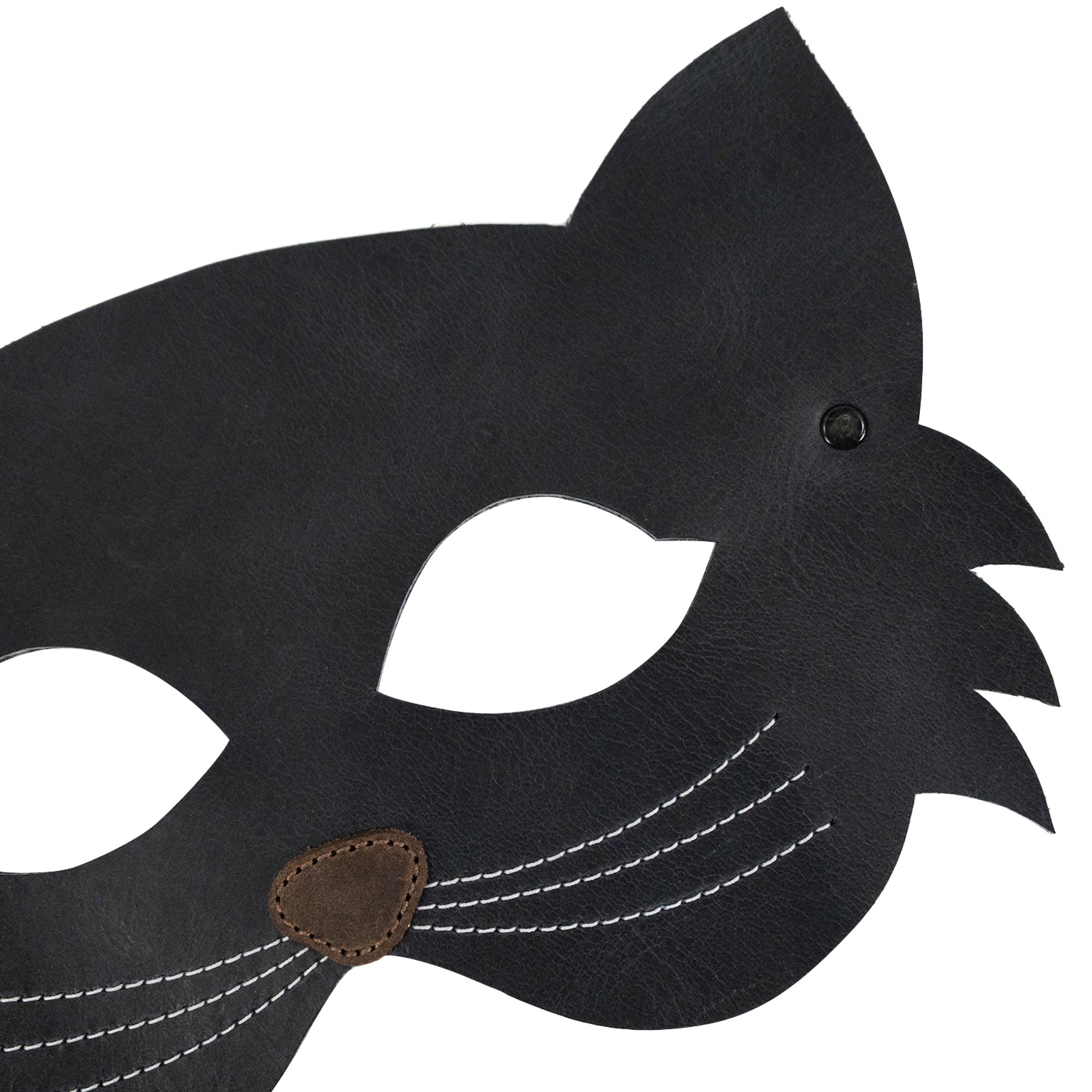Close up of the Cat Shape Face Mask by Hide & Play, highlighting its unique design and fine details in full grain leather. This artisan-crafted accessory is ideal for themed parties and everyday fun. Handmade in La Antigua Guatemala, it reflects a commitment to small batch production and superior craftsmanship.