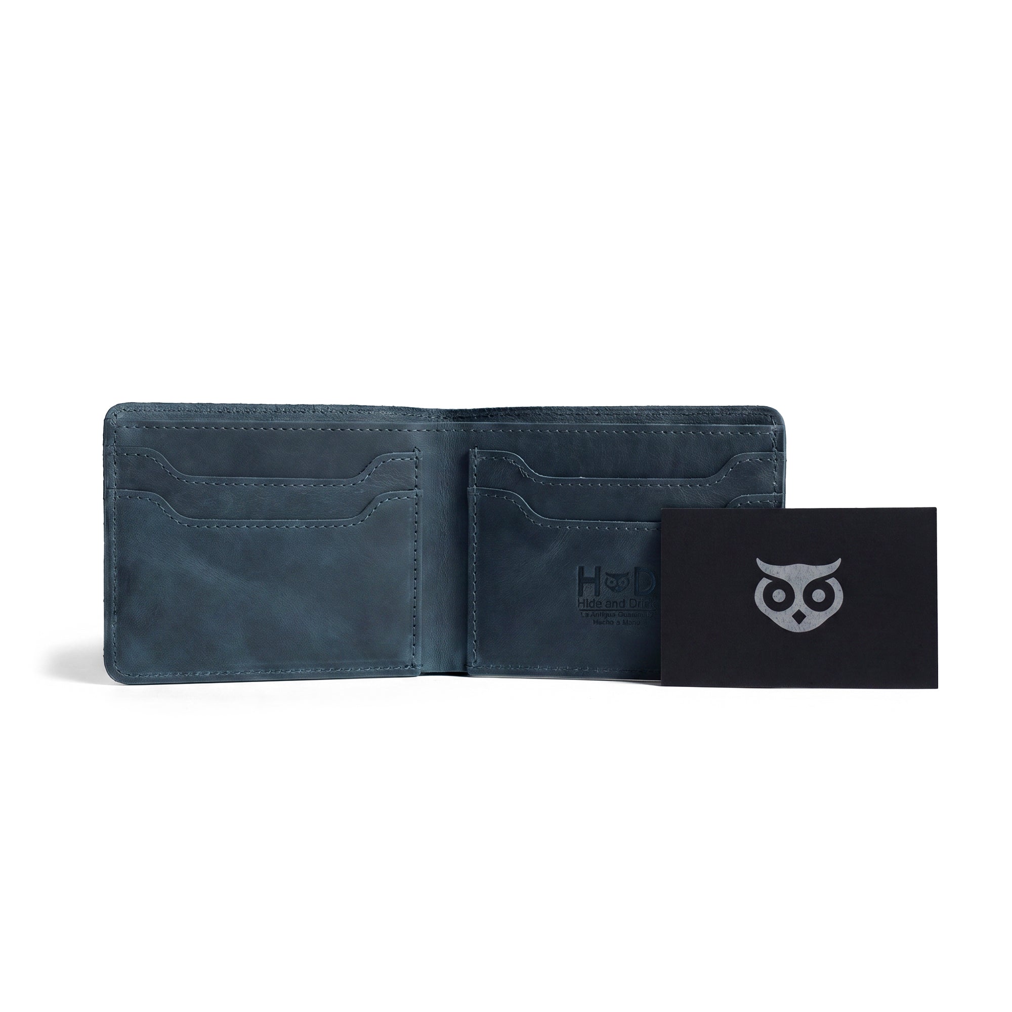 Inside view of the dark brown Classic Wallet from Hide & Drink, highlighting its organizational features. This Classic Bifold Wallet serves as a convenient storage case for identification and is crafted from durable Full Grain Leather. Perfect for travel, it showcases artisan craftsmanship with small batch production, hand cut and sewn in La Antigua Guatemala & Oaxaca Mexico.