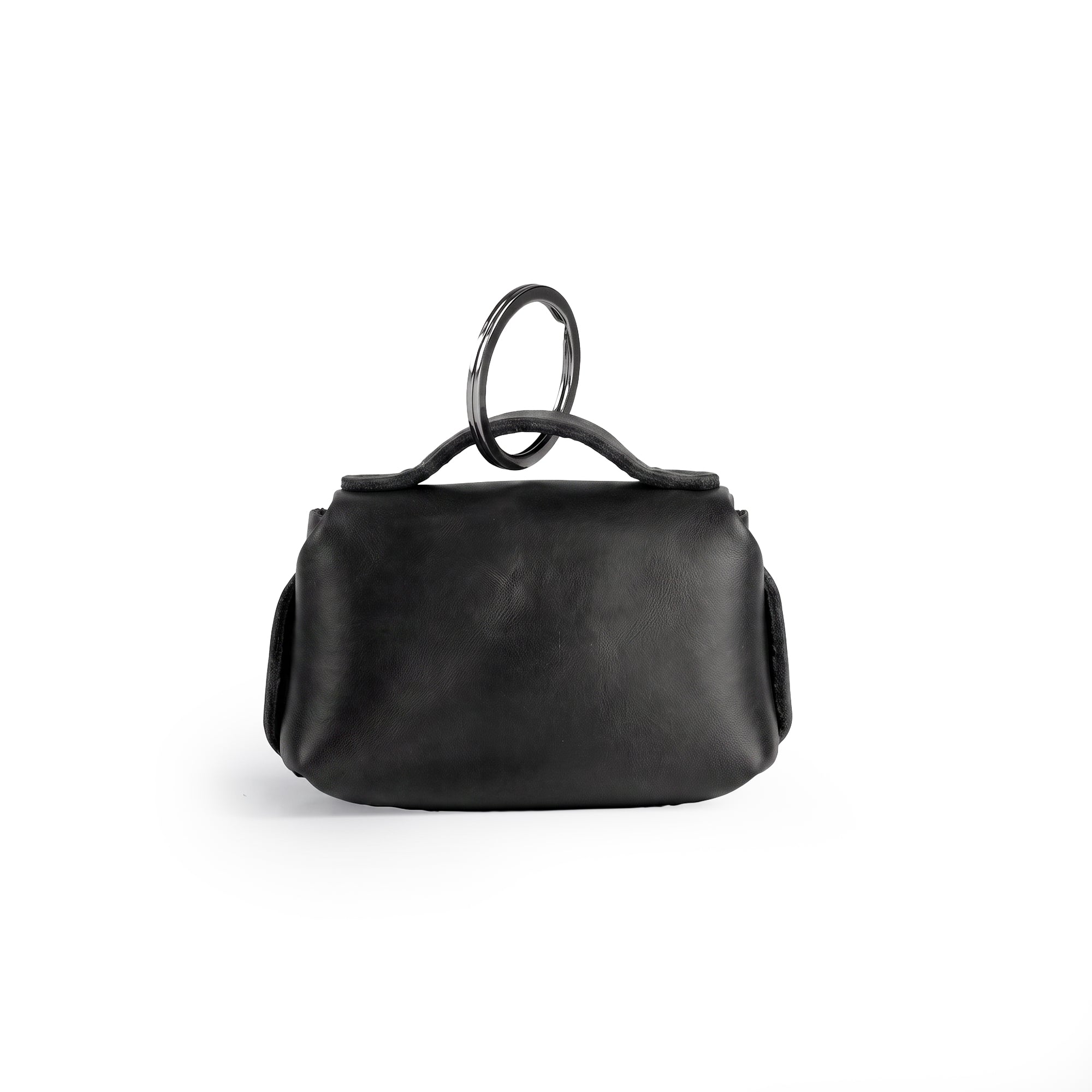 Back view of the Tiny Handbag Keychain by Hide & Drink, emphasizing its sturdy black Full Grain Leather construction and key ring. This handmade piece highlights small batch production and artisan techniques from La Antigua Guatemala.