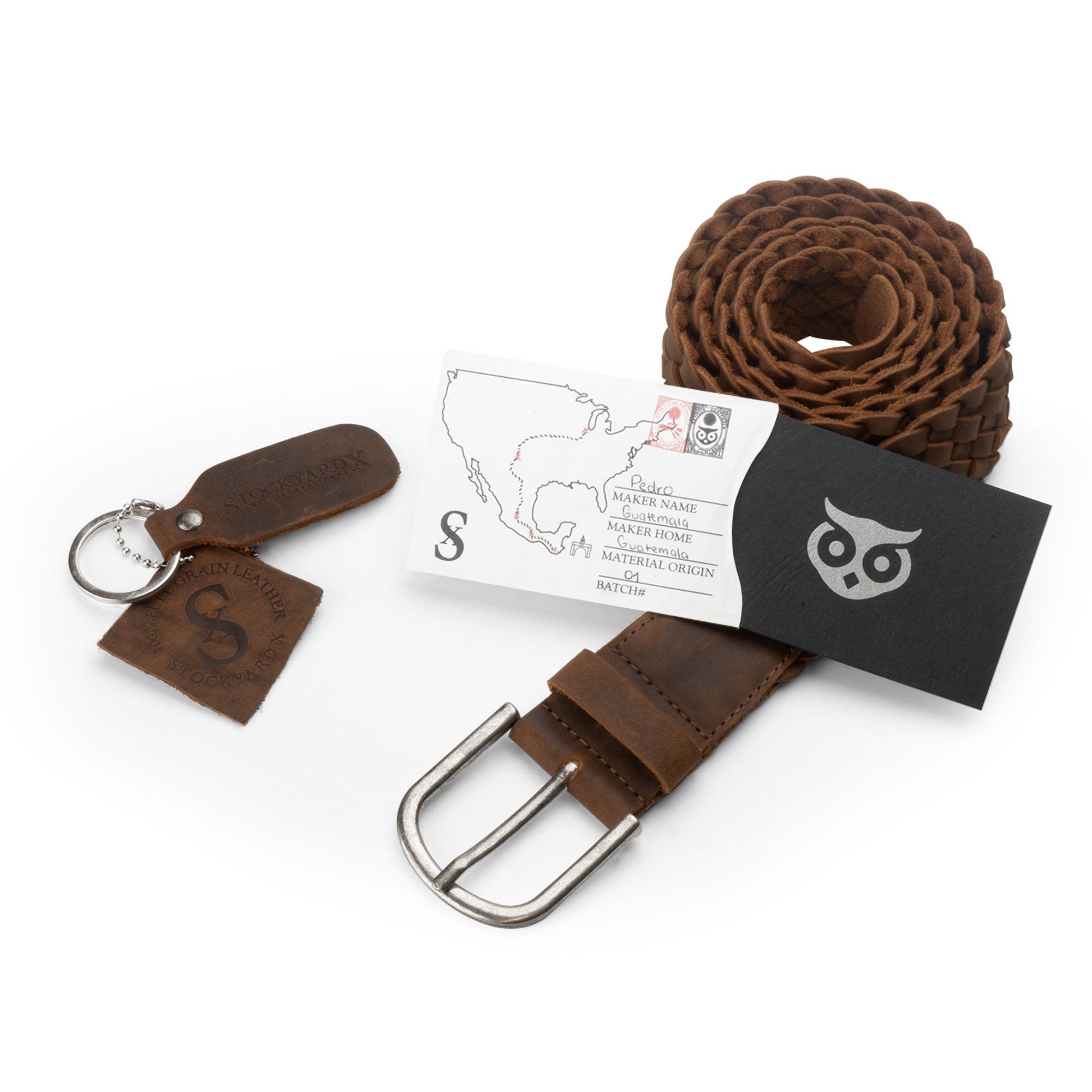 The Single-Piece Braided Belt by Hide & Drink, alongside its tags and identification, underlining the commitment to craftsmanship and quality. Made from full grain leather, this belt is part of a small batch production and artisan techniques in La Antigua Guatemala & Oaxaca Mexico. A stylish, handmade accessory perfect for men.