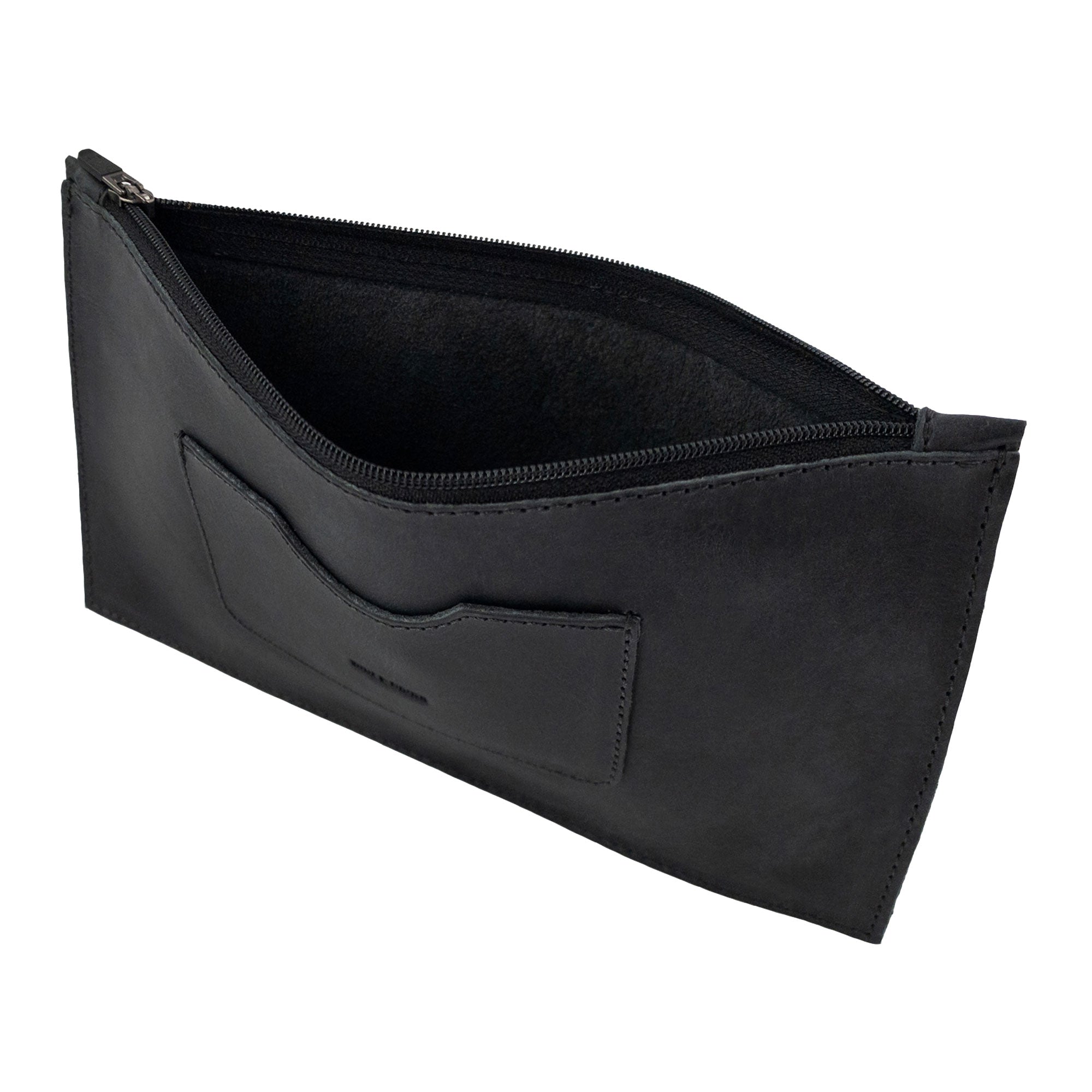 Interior view of a black rectangular zippered handbag by Hide & Drink, showcasing its spacious design. This female purse features a convenient card slot and is crafted from full grain leather, highlighting the careful artisan work synonymous with small batch production, made in La Antigua Guatemala & Oaxaca Mexico.