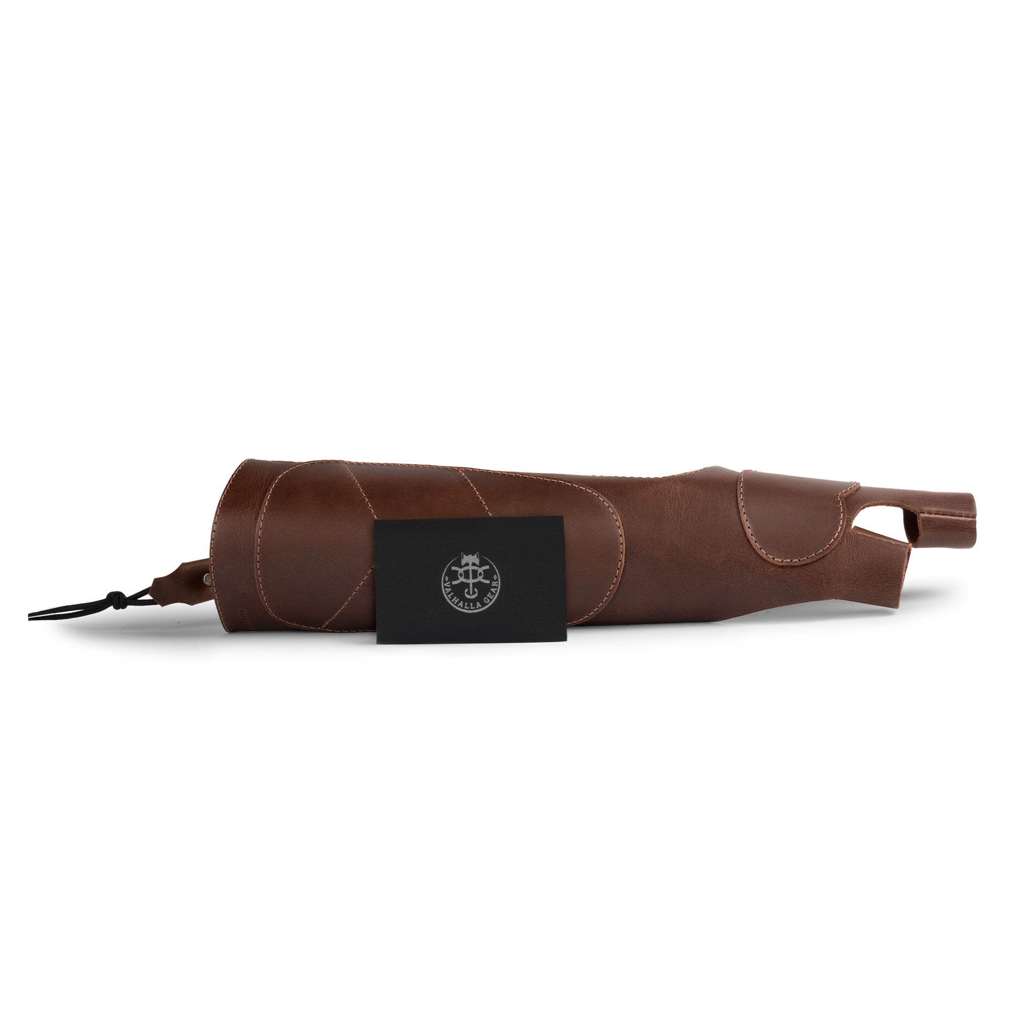 The Bowmaster, Forearm Guard for Archers by Valhalla Gear displayed alongside its packaging. The full grain leather arm guard promotes an elegant design for archers, serving as a protective bracer while showcasing the dedication to quality craftsmanship. This artisan product is handmade in La Antigua Guatemala, perfect for archers searching for reliable and stylish shooting gear.