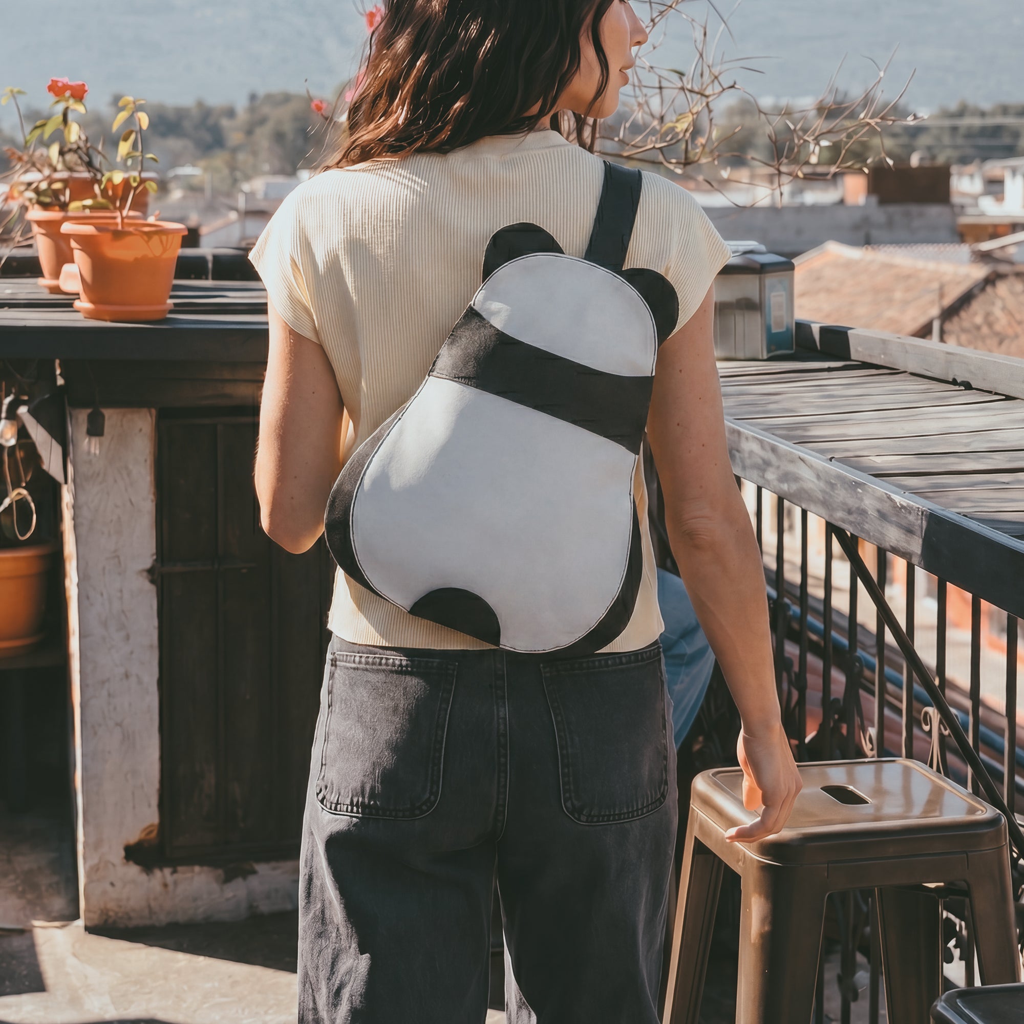 Open view of the Panda-Shaped Crossbody Bag by Hide & Play, revealing ample storage space. This full grain leather bag is a comfortable and functional accessory, showcasing the artisan quality and small batch production from La Antigua Guatemala & Oaxaca Mexico.