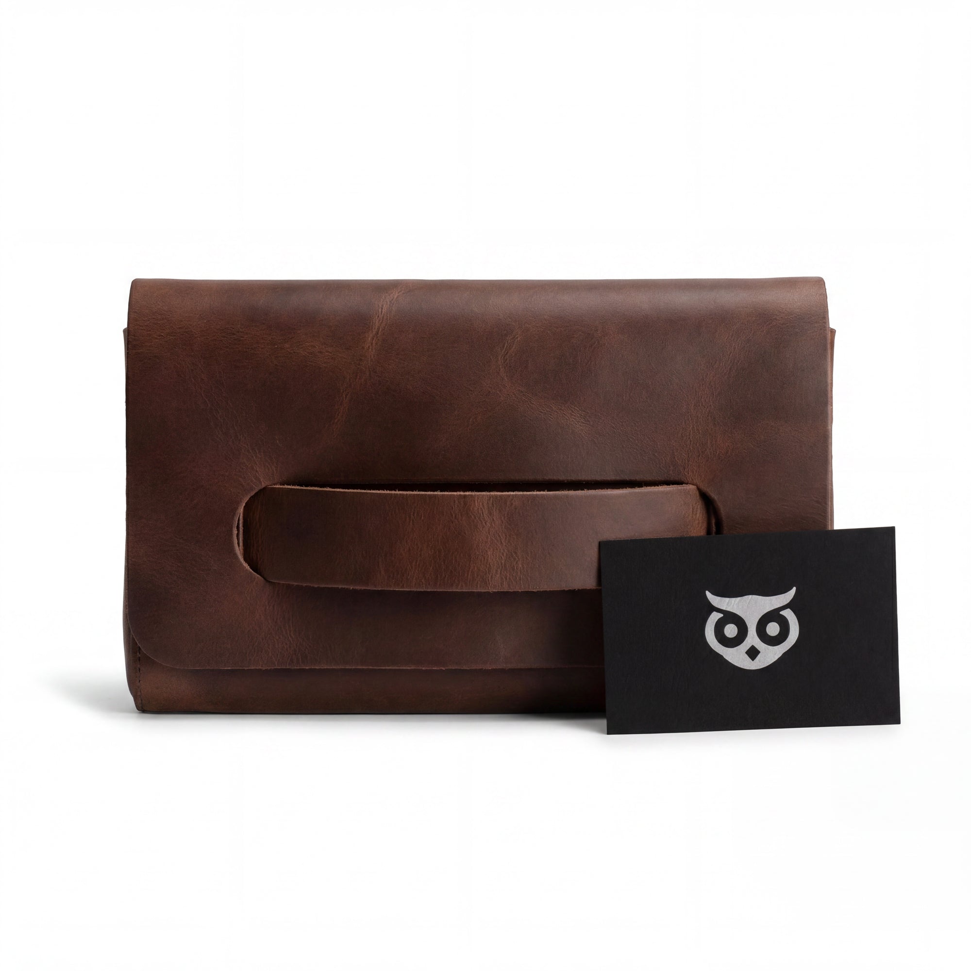 The Clutch Bag With Handle from Hide & Drink, styled with included accessories. This Full Grain Leather Clutch Bag with Handle is a great gift for women, perfect as a handbag or night bag, crafted with love in La Antigua Guatemala & Oaxaca Mexico.