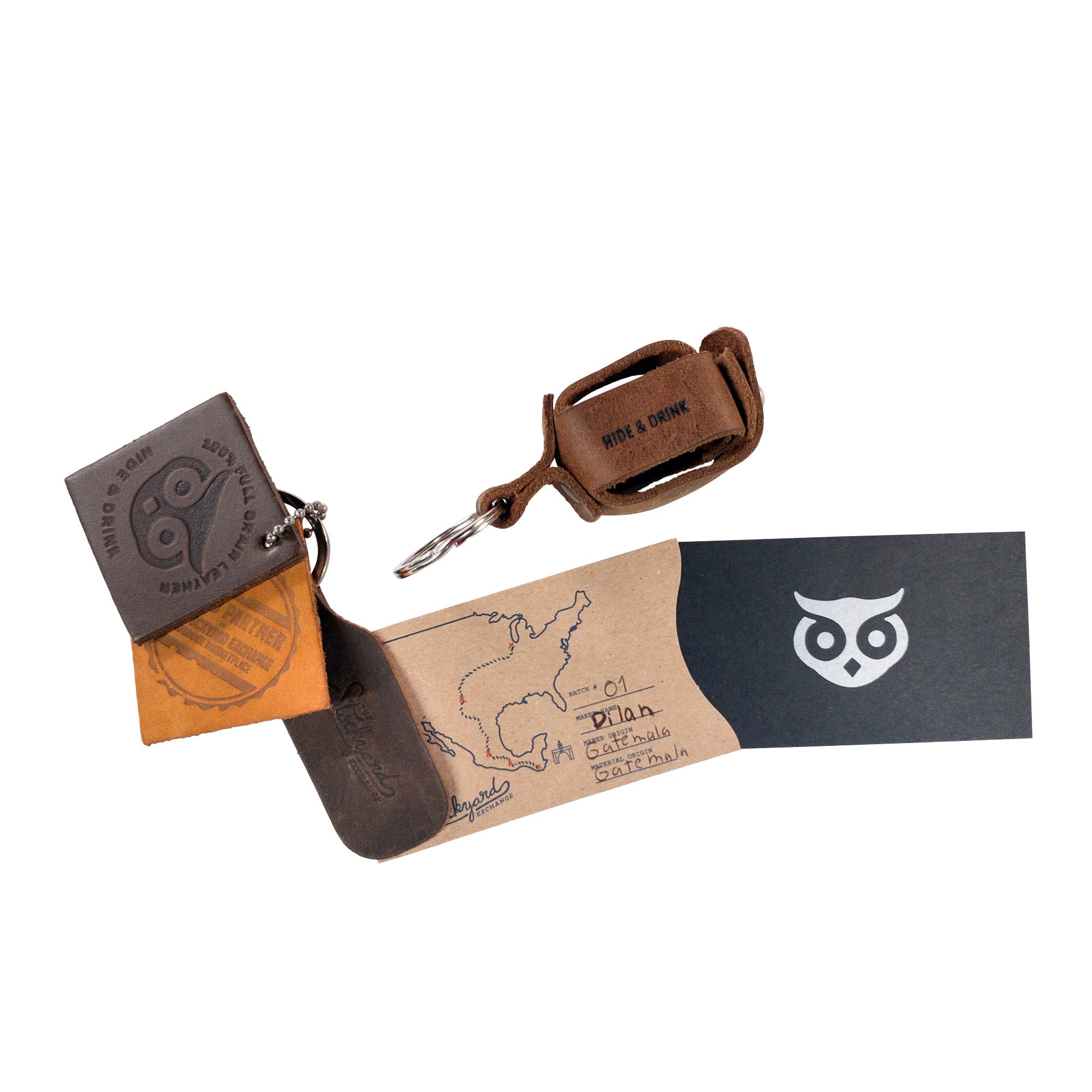 Hide & Drink Measuring Tape Holder Keychain displayed alongside other leather goods, emphasizing its compatibility and style for measuring tape (Tape not Included). Made using Full Grain Leather, this Key Ring Organizer is essential for tailor accessories, with a focus on artisan quality from small batch production, hand cut, hand sewn, and uniquely fire branded, made in La Antigua Guatemala & Oaxaca Mexico.