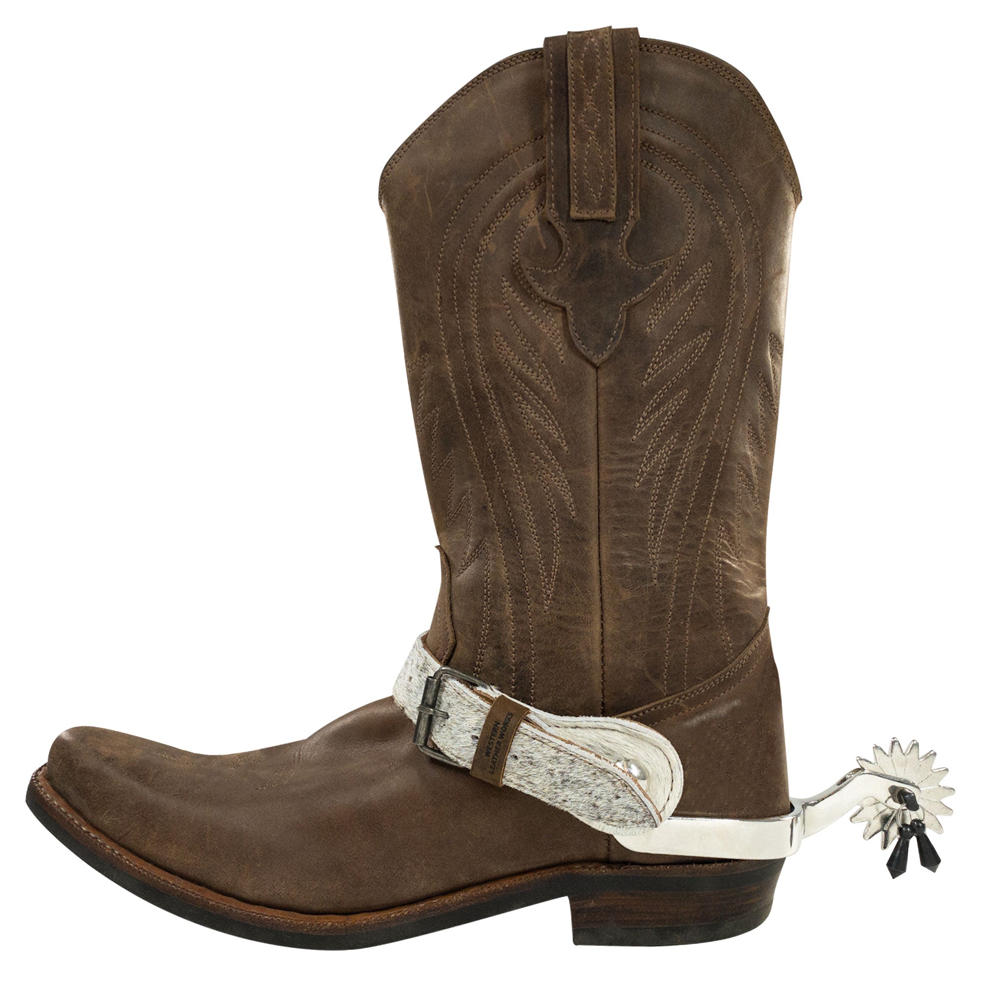 Stylish spur strap attached to a brown cowboy boot from Western Leather Works. This Spur Straps (2 Pack) offers a durable addition to your riding gear, made from high-quality full grain leather for horse rides and equestrian activities.