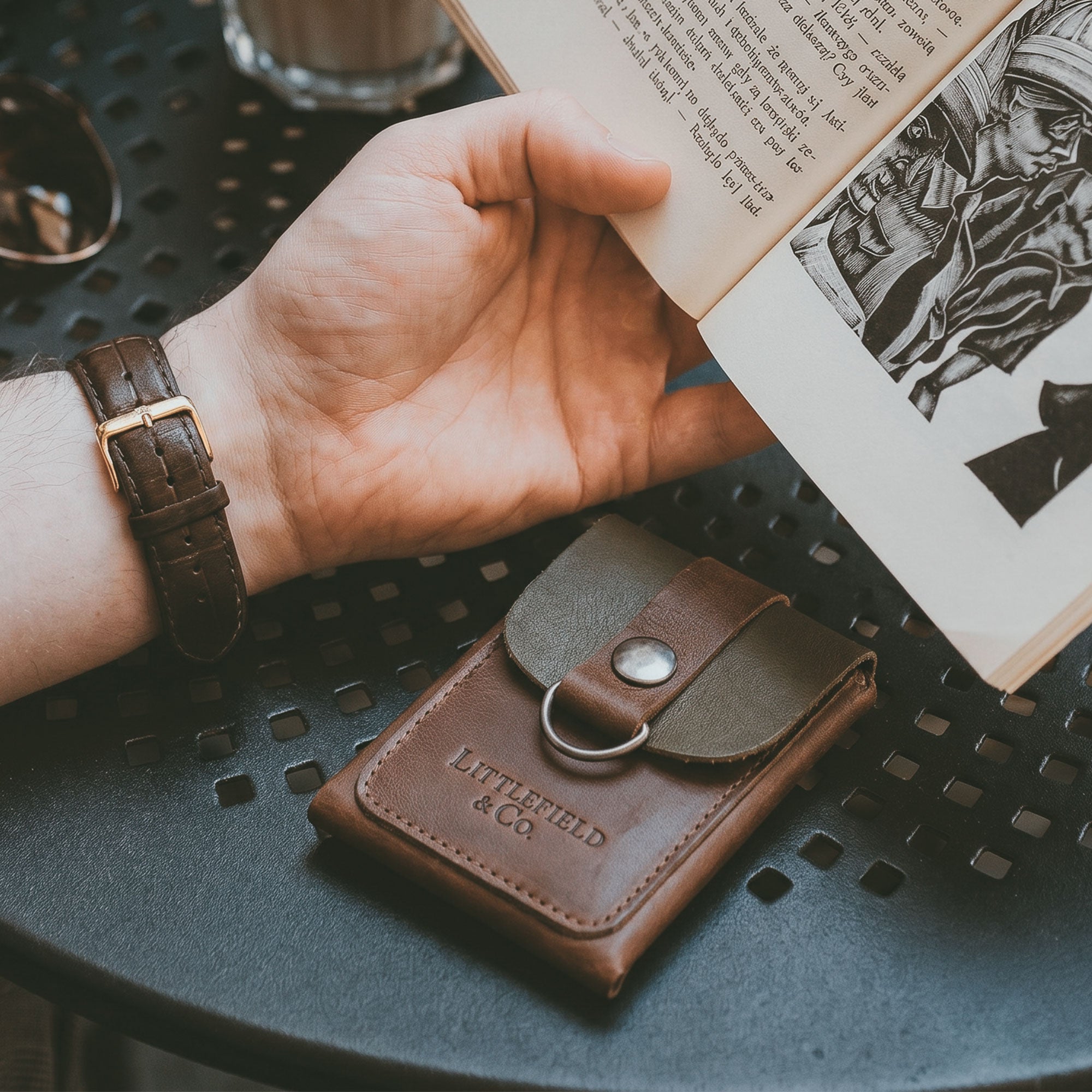 Featuring the Vintage Adventure Wallet from Littlefield Chicago, this image depicts a stylish wallet in use, perfect as a classic men's wallet. The full grain leather wallet serves as an effective compact men's bill organizer and travel accessory, embodying handmade artisan craftsmanship from La Antigua Guatemala & Oaxaca Mexico.