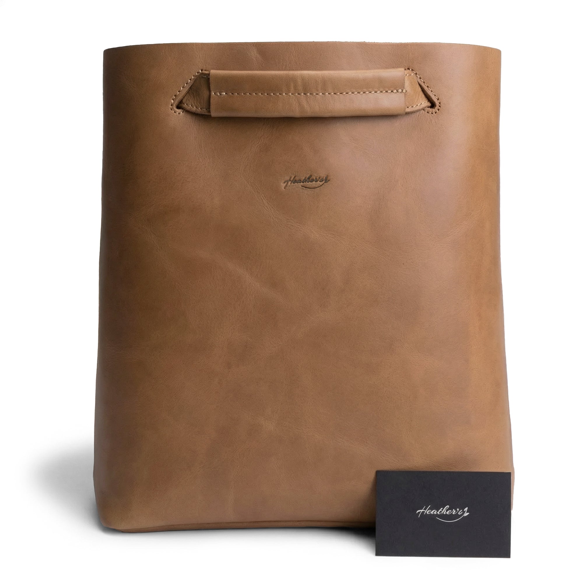 Front view of Heather's Convertible Backpack to Shoulder Bag, designed with a minimalist aesthetic. This spacious crossbody for women serves as a squared purse made from Full Grain Leather. Handmade in La Antigua Guatemala and Oaxaca Mexico, it showcases artisan skills with small batch production methods, featuring hand cut, hand sewn, and fire branded craftsmanship.