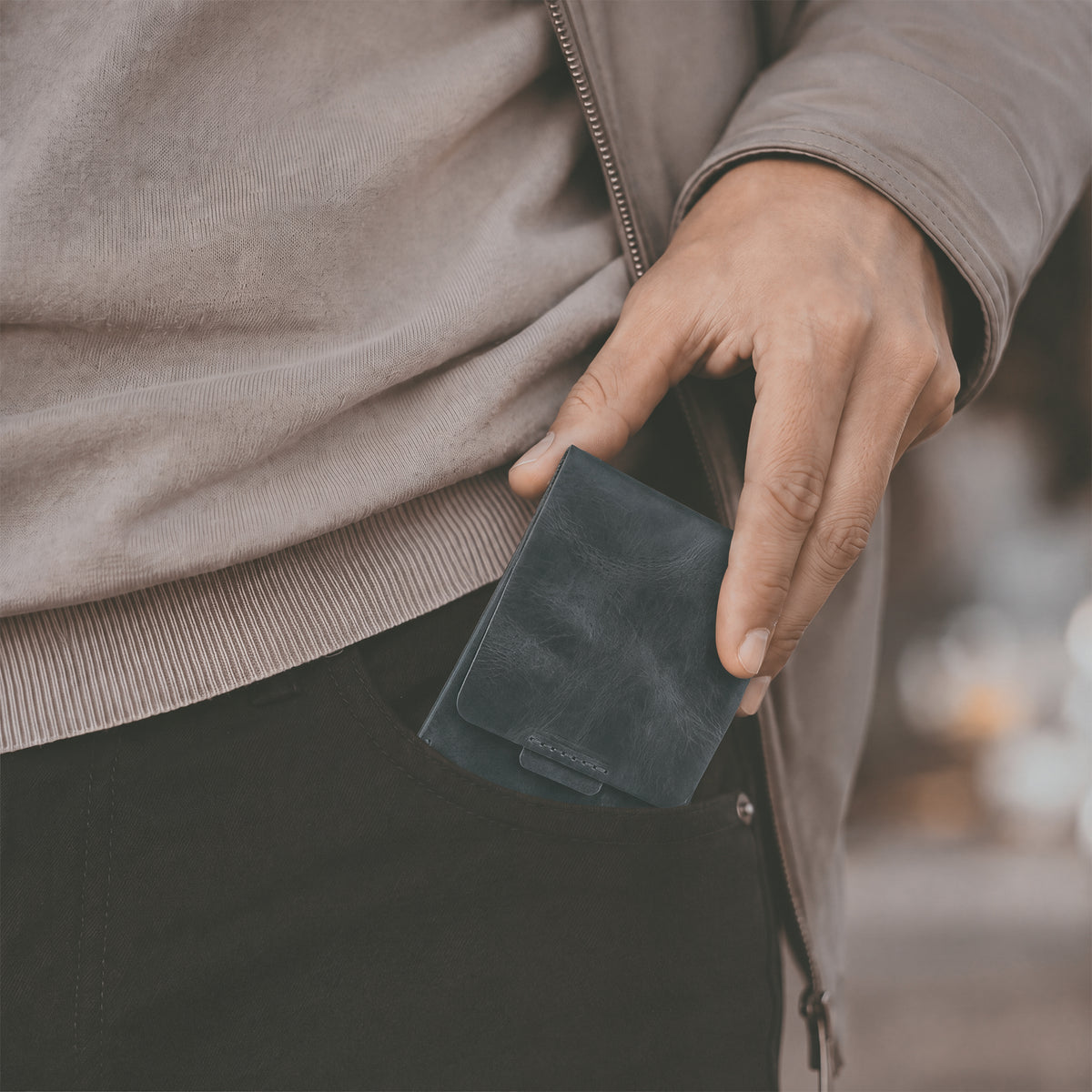 Hide & Drink Slim Card Holder shown upright, sleek and stylish design made from full grain leather. Perfect for holding up to 4 cards plus folded bills, this wallet is lovingly crafted by artisans in La Antigua Guatemala.