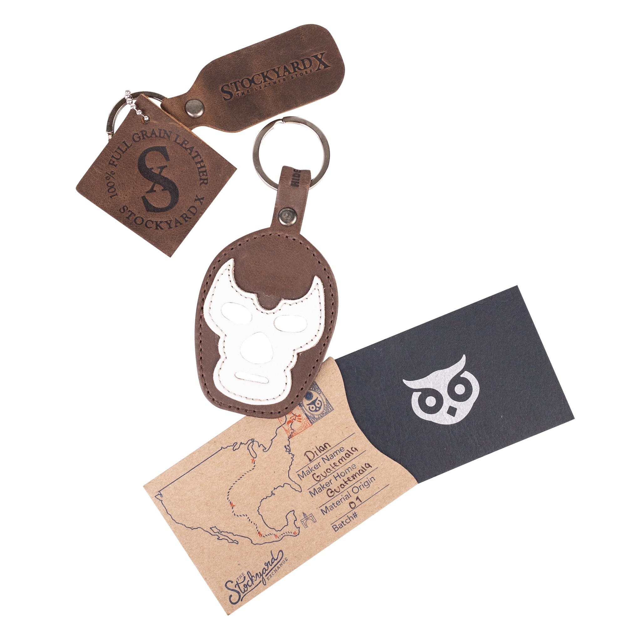 Close-up of the Luchador Mask Leather Keychain illustrating intricate craftsmanship, making it a standout choice for a keyring. This key organizer from Hide & Drink is made from durable full grain leather and continues the tradition of small batch production, hand cut and sewn by artisans in La Antigua Guatemala and Oaxaca Mexico.