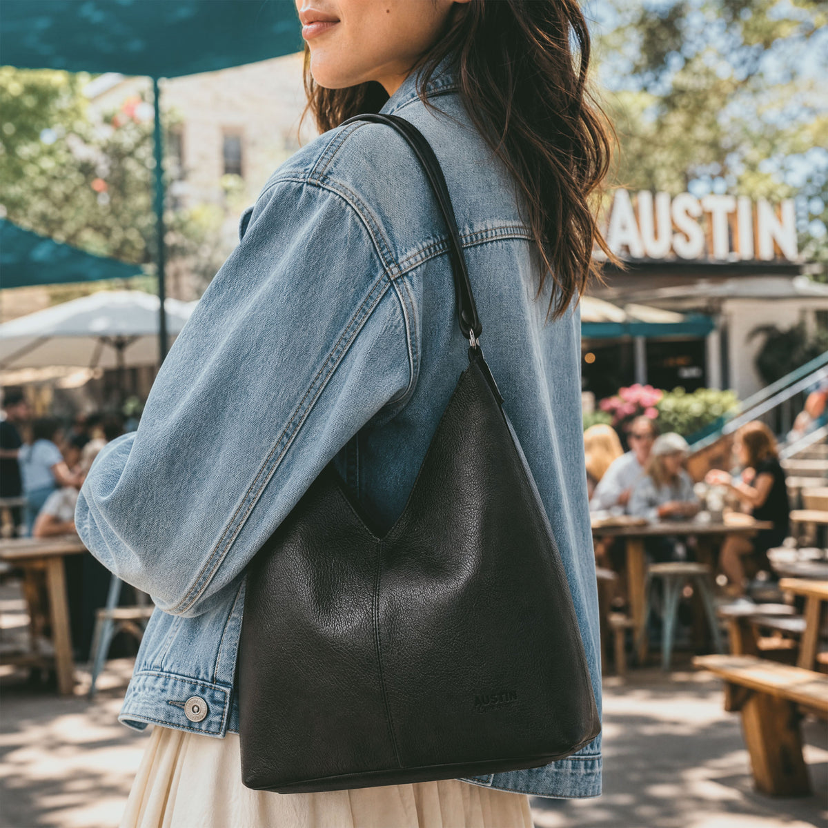 Austin Genuine The Tarrytown Hobo Bag dimensions shown in a product diagram, including 12-inch height, 11.5-inch width, 5-inch depth, and 19-to-36-inch strap. The Tarrytown Hobo Bag Full Grain Leather, StockyardX, Small Batch Production, Hand Cut, Hand Sewn, Fire Branded, Artisan, Handmade in La Antigua Guatemala & Oaxaca Mexico.