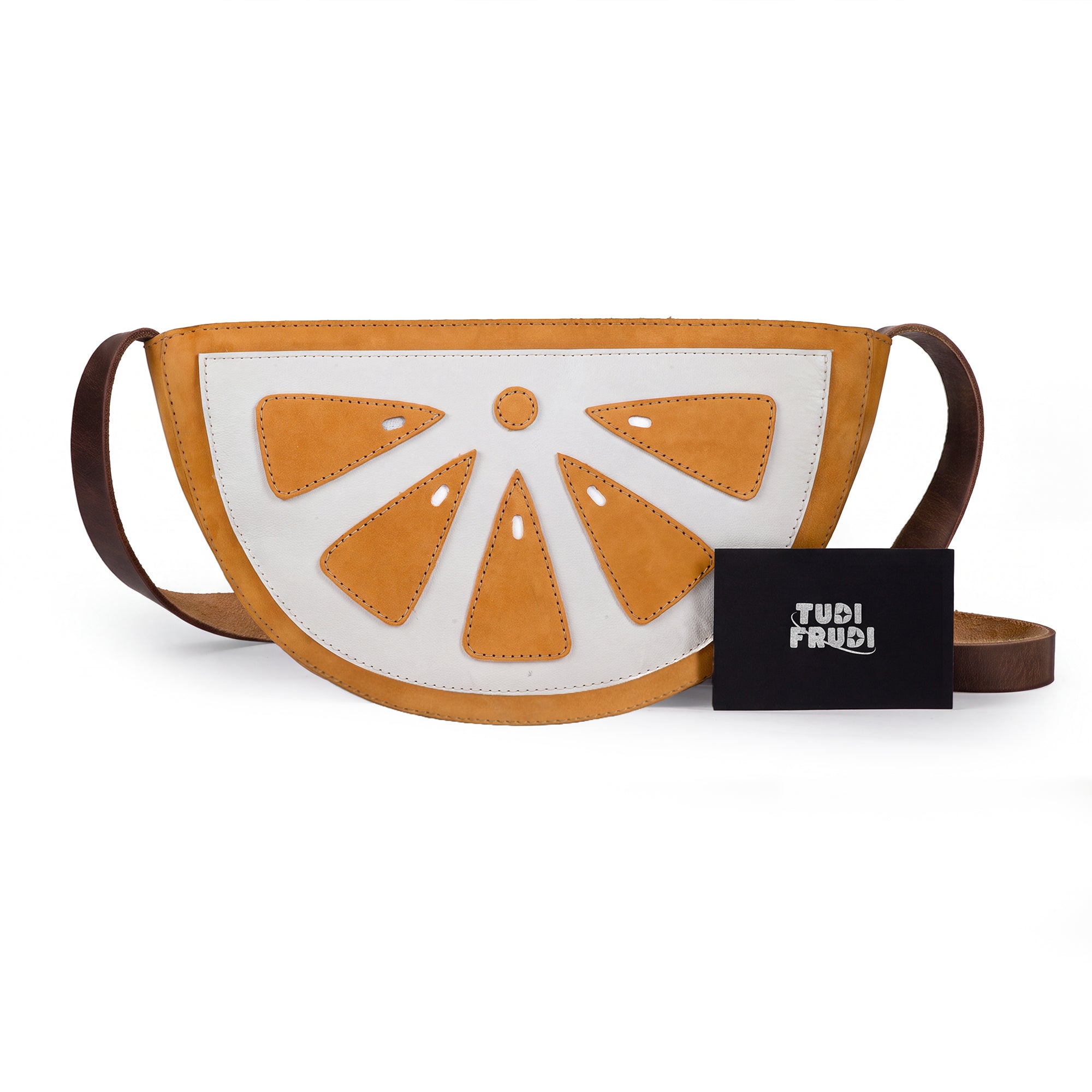 Lemon-Shaped Shoulder Bag by Tudi Frudi featuring a contemporary lemon slice design, showcasing its playful appeal. This Lemon-Shaped Shoulder Bag with Adjustable Strap doubles as a stylish Messenger Bag and Vintage Purse. Crafted from Full Grain Leather, it highlights Small Batch Production, hand cut and hand sewn artistry from artisans in La Antigua Guatemala & Oaxaca Mexico.