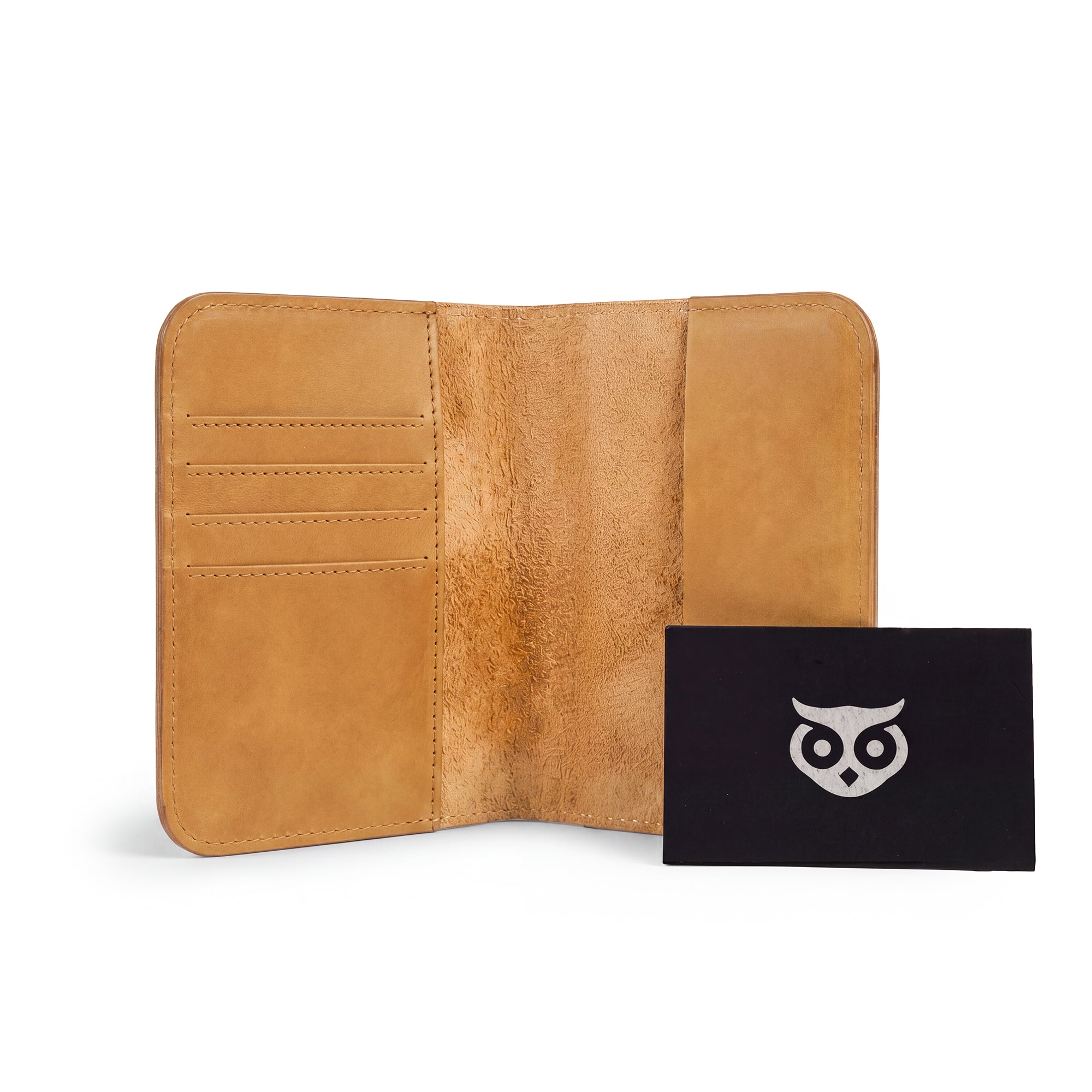 Interior compartments of the Hide & Drink Travel Wallet showcasing efficient design. This travel wallet is a stylish bifold passport case, artisan-made with full grain leather in La Antigua Guatemala.