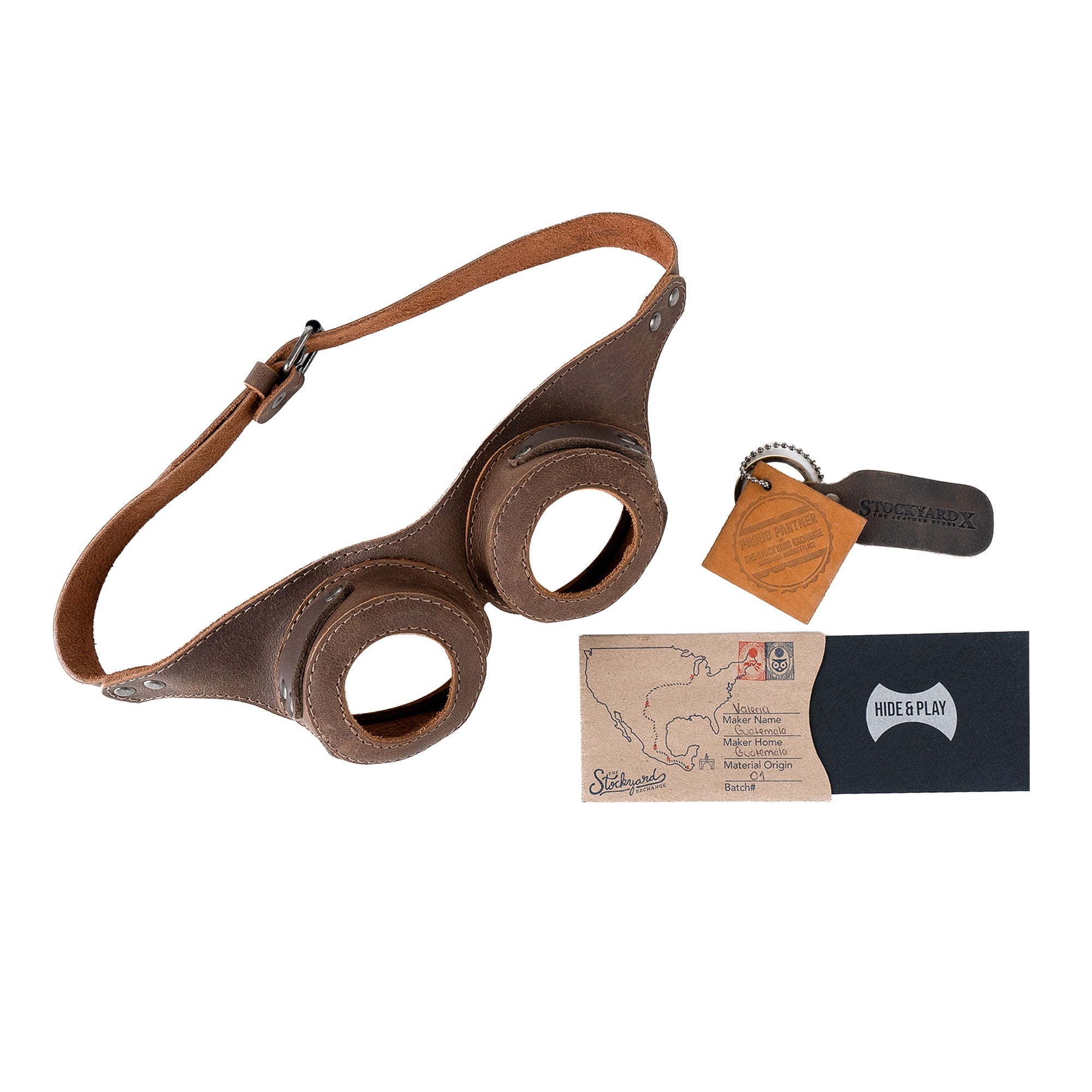 The complete package of Steampunk Style Goggles by Hide & Play, featuring branding and artisan details. This retro cosplay prop is perfect for unique costumes, handcrafted with full grain leather in La Antigua Guatemala & Oaxaca Mexico.