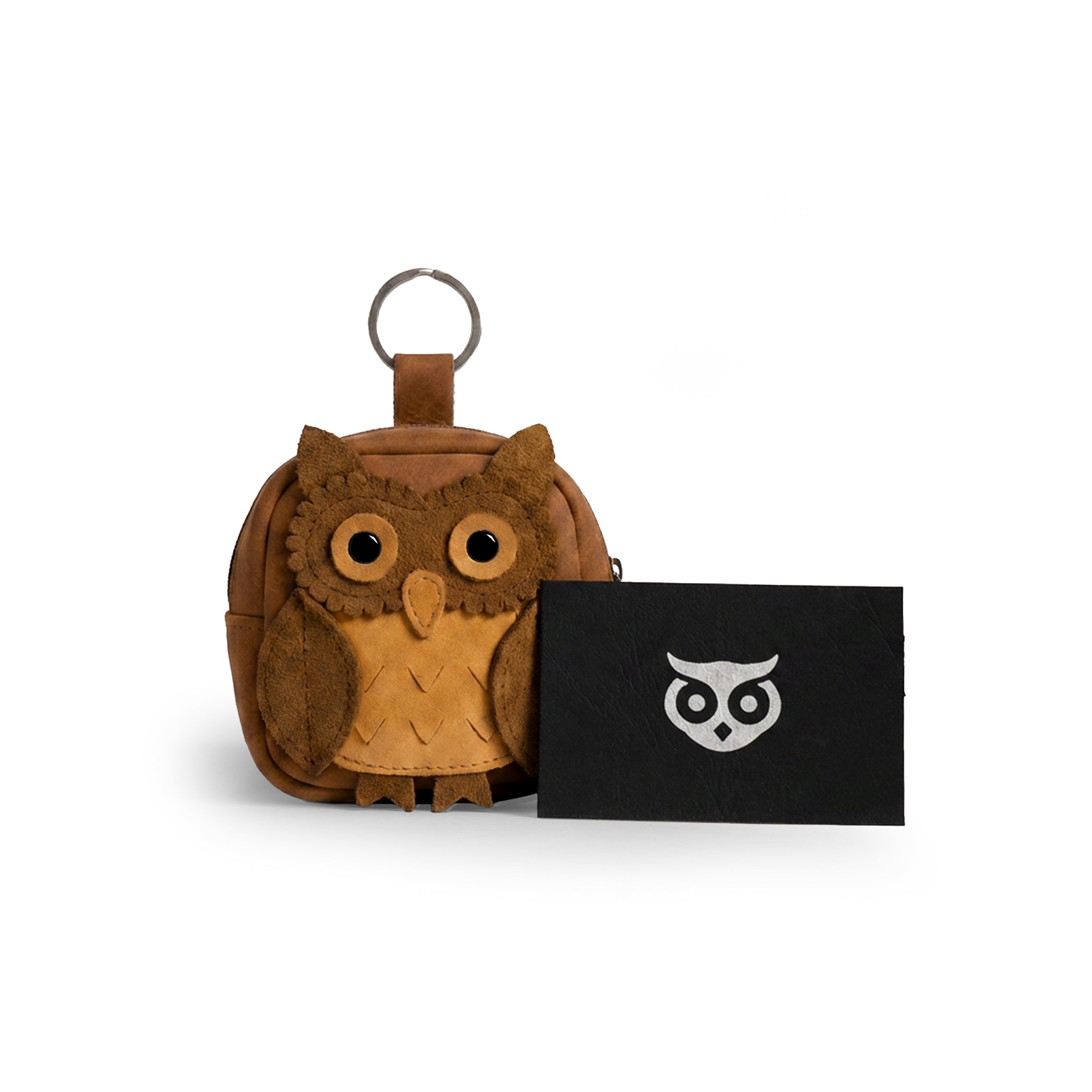 Discover the Owl Mini Backpack by Hide & Drink, featuring an adorable owl design that's perfect as an Owl Mini Backpack Coin Purse or Cute Keychain. Ideal for coins and small items, this owl-shaped case is made from high-quality Full Grain Leather, emphasizing small batch production. Each item is expertly hand cut, hand sewn, fire branded, and crafted by artisans in La Antigua Guatemala & Oaxaca Mexico.