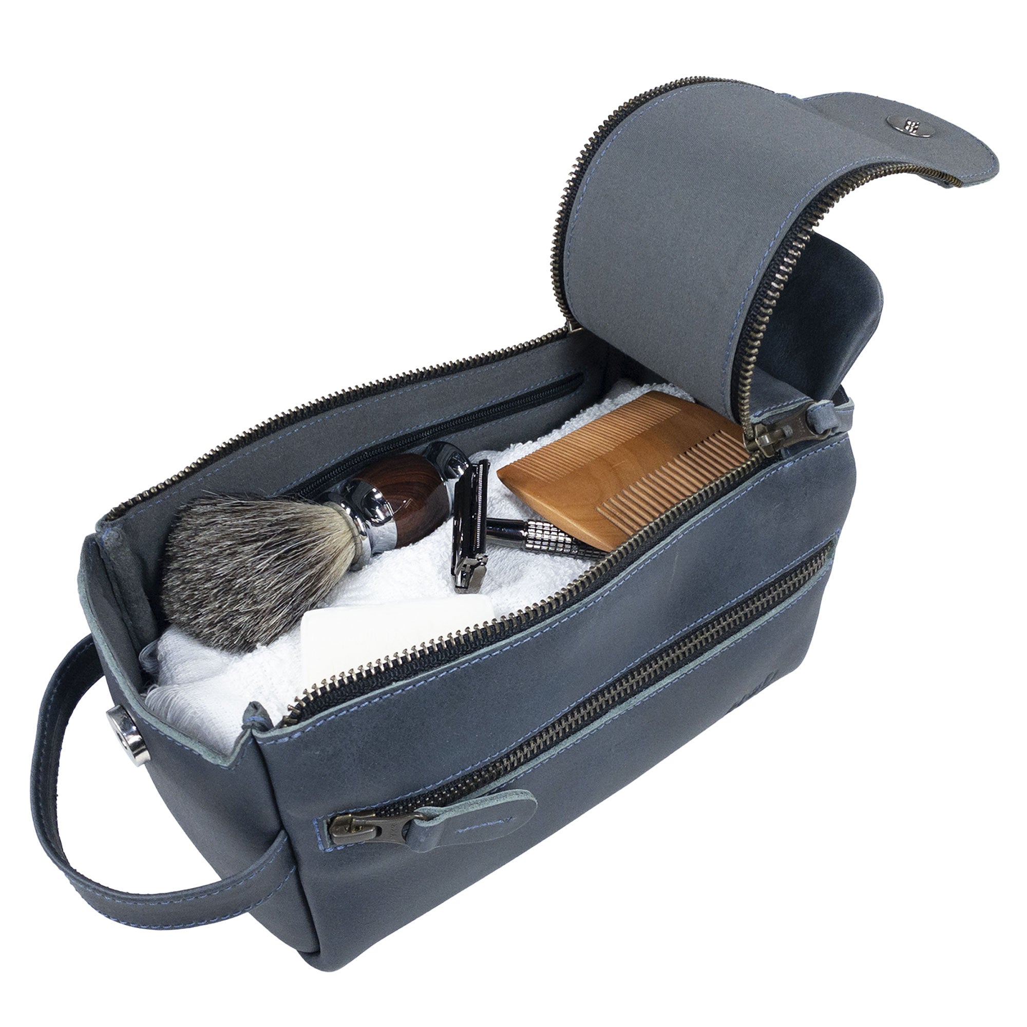 Hide & Drink's blue Toiletry Bag featuring essentials inside, emphasizing its utility. This Full Grain Leather Toiletry Bag is a versatile Hand Bag and Dopp Kit Organizer for grooming items. StockyardX, Handmade, S.