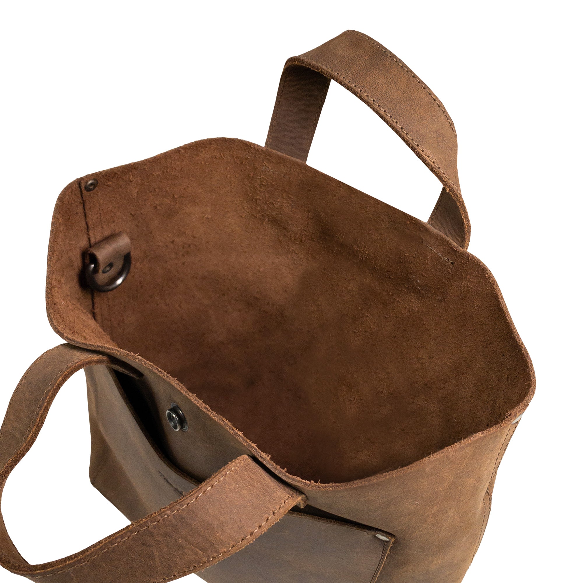 Interior view of Heather's Crossbody Tote Bag with Pouch, showcasing the beautiful craftsmanship and rich texture of full grain leather. This rustic handbag is designed as a vintage style shoulder case, perfect for travel and shopping, handmade in La Antigua Guatemala & Oaxaca Mexico.
