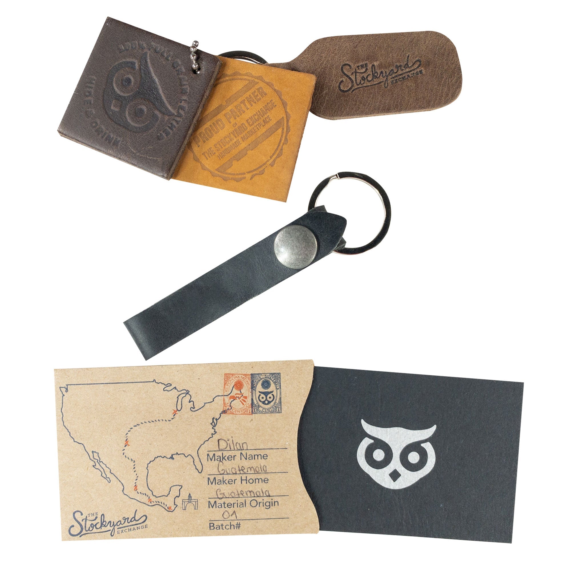 Hide & Drink Loop Keychain presented with business cards, displaying a sleek design. This keyring organizer, made from durable full grain leather, is handcrafted in La Antigua Guatemala & Oaxaca Mexico, showcasing artisan craftsmanship.
