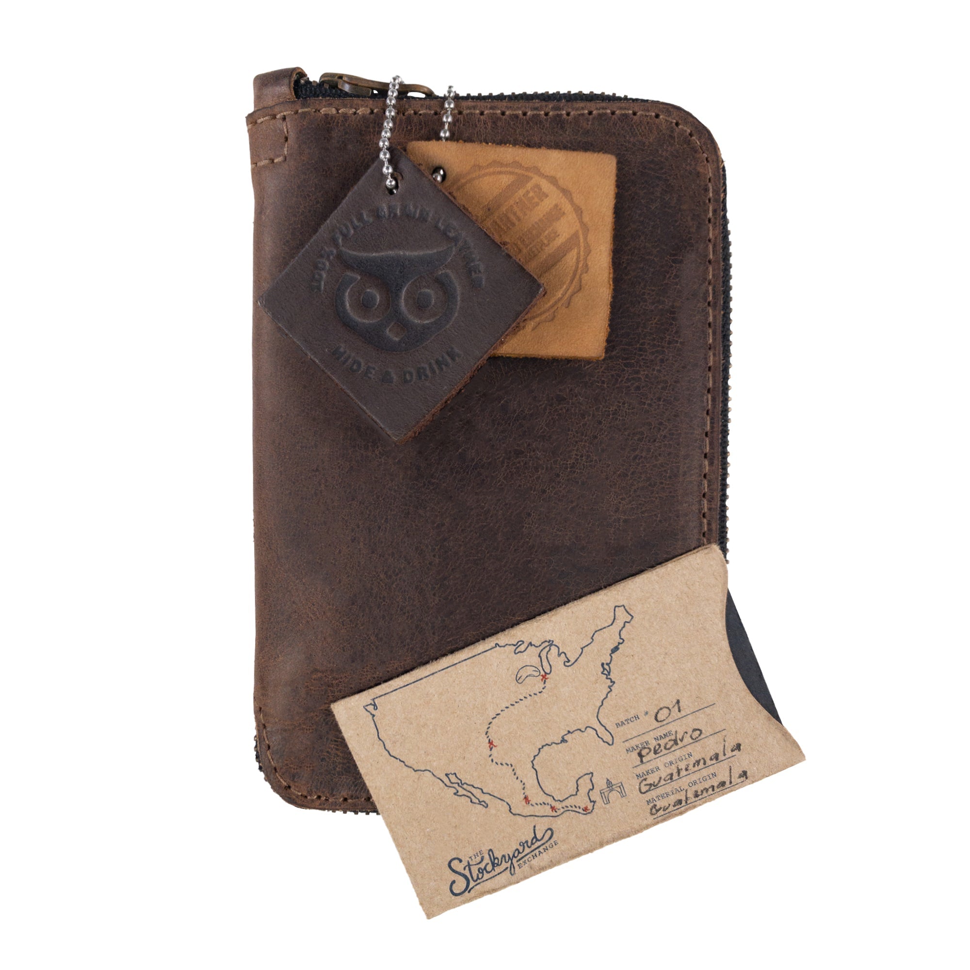 Hide & Drink Zippered Journal Cover for Moleskine (Notebook NOT Included) displayed with leather tags and cards, illustrating its unique craftsmanship from La Antigua Guatemala.