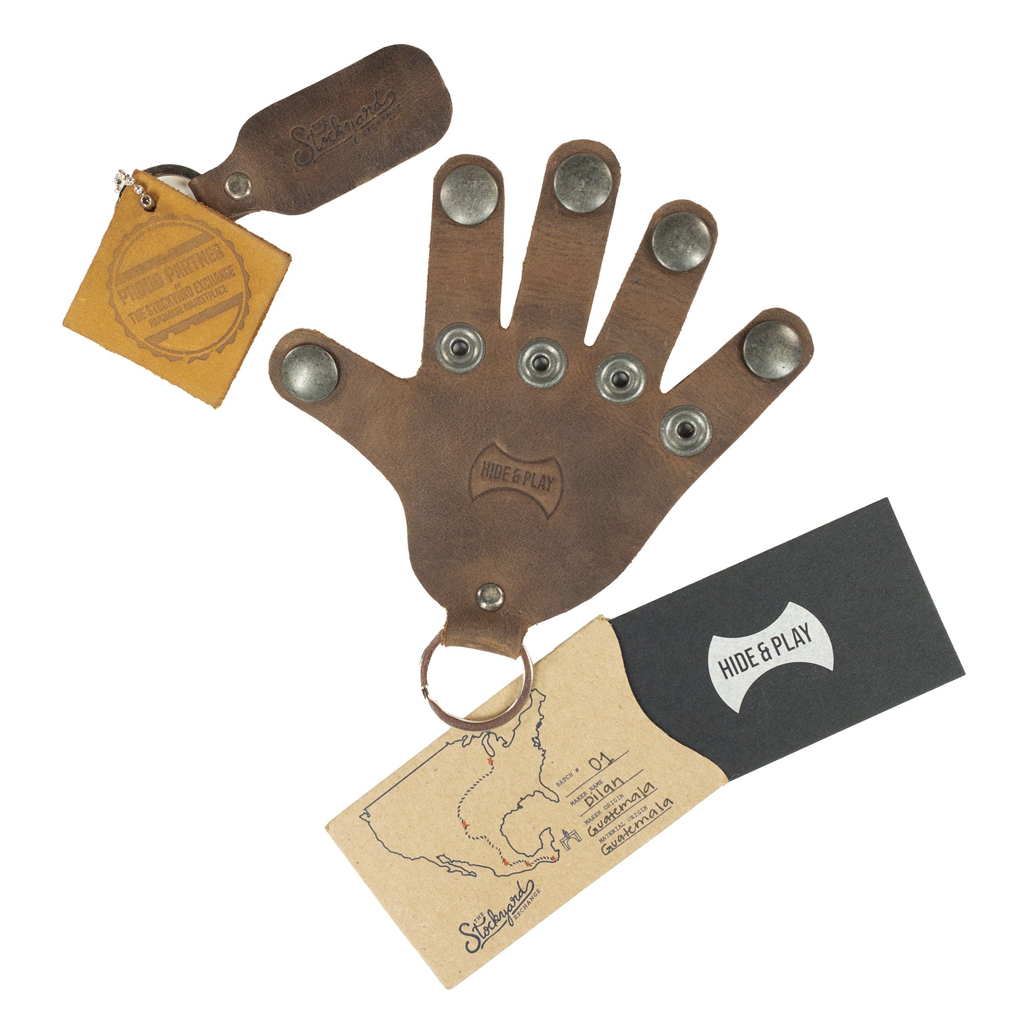 A beautifully packaged Hand Keychain by Hide & Play, featuring a unique hand shape design in full grain leather. This versatile Full Grain Leather Hand Shape Keychain can be used as a keyring or key organizer. Each piece represents handmade artistry from La Antigua Guatemala & Oaxaca Mexico, focusing on quality and small batch production.