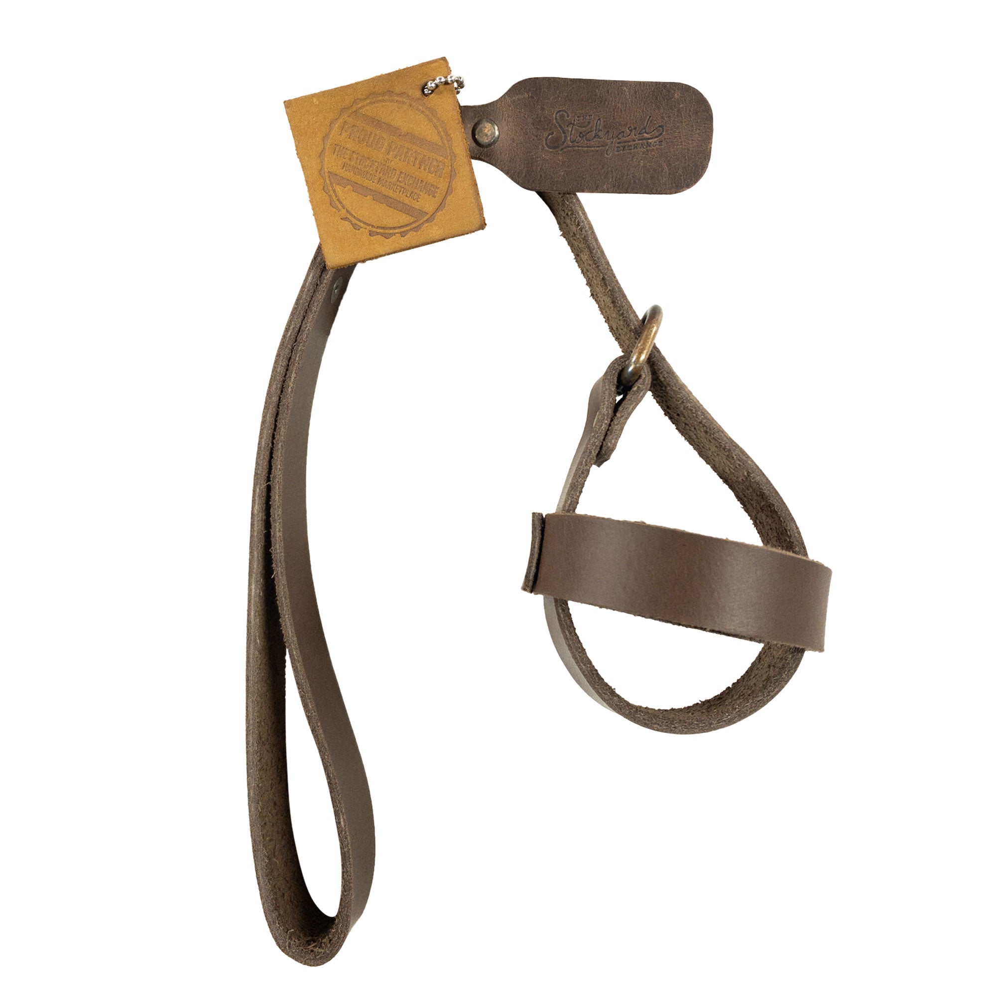 The unique tag of the Dog Ball Holder by Taco Dog, which reinforces its artisan quality and small batch production ethos. This hands-free accessory for dog ball toys is made from premium full grain leather, exhibiting the charm and craftsmanship of handmade pet supplies from La Antigua Guatemala.