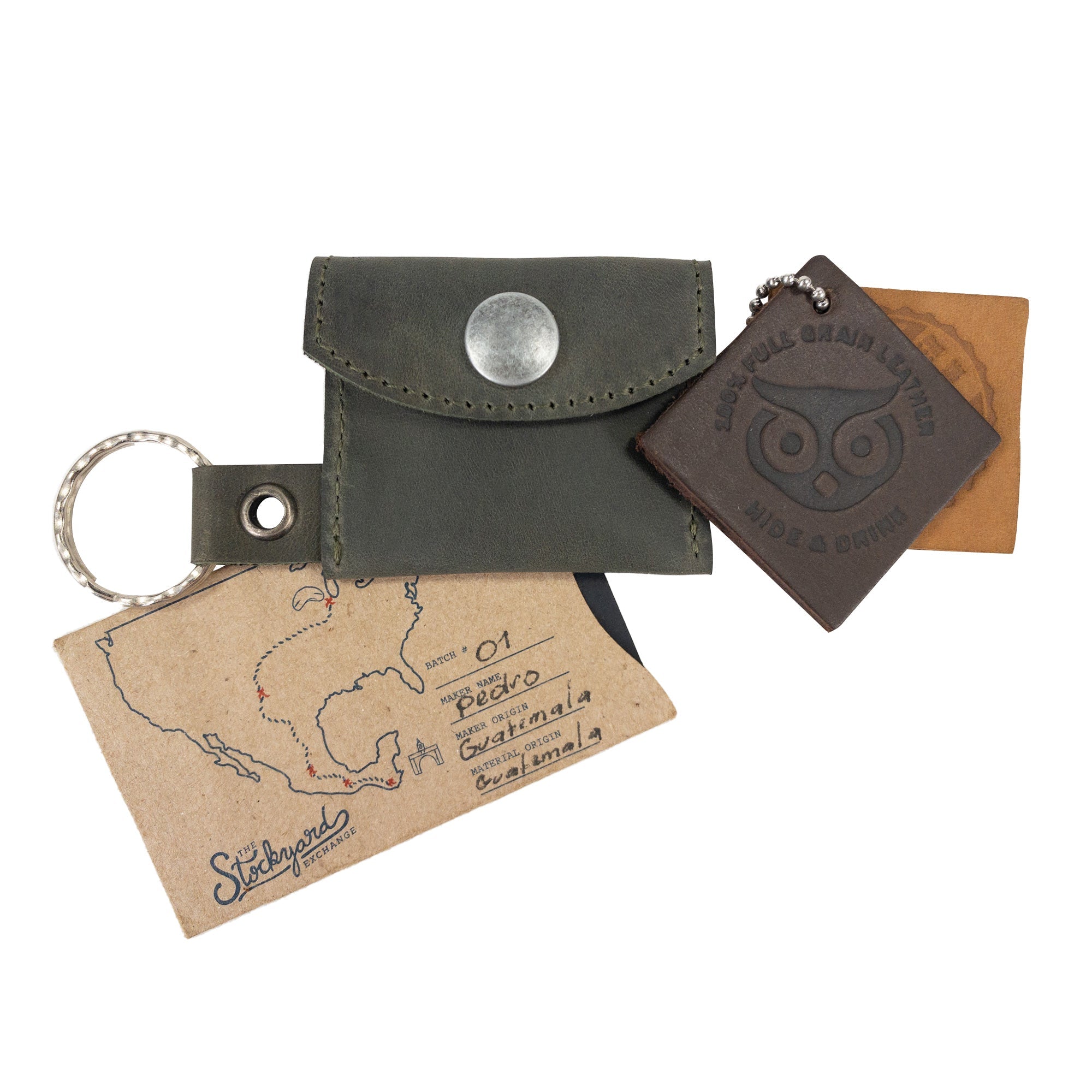 Artistic view of the Tiny Coin Holder Keychain by Hide & Drink showcasing its unique design. Crafted from Full Grain Leather, this Tiny Coin Holder is a product of small batch production and dedicated artisan technique.