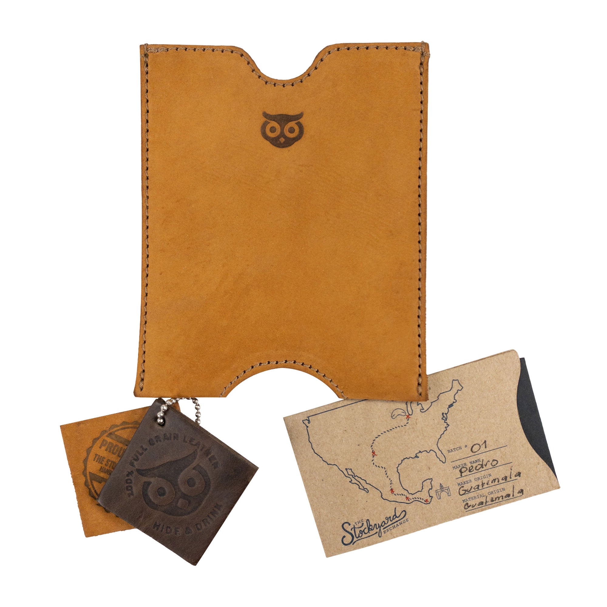 Hide & Drink Passport Sleeve accompanied by artisanal tags, emphasizing its unique design and handmade attributes. This Travel Passport Pocket Sleeve, made from Full Grain Leather, reflects the small batch production and meticulous hand cut and hand sewn techniques of skilled artisans in La Antigua Guatemala & Oaxaca Mexico.