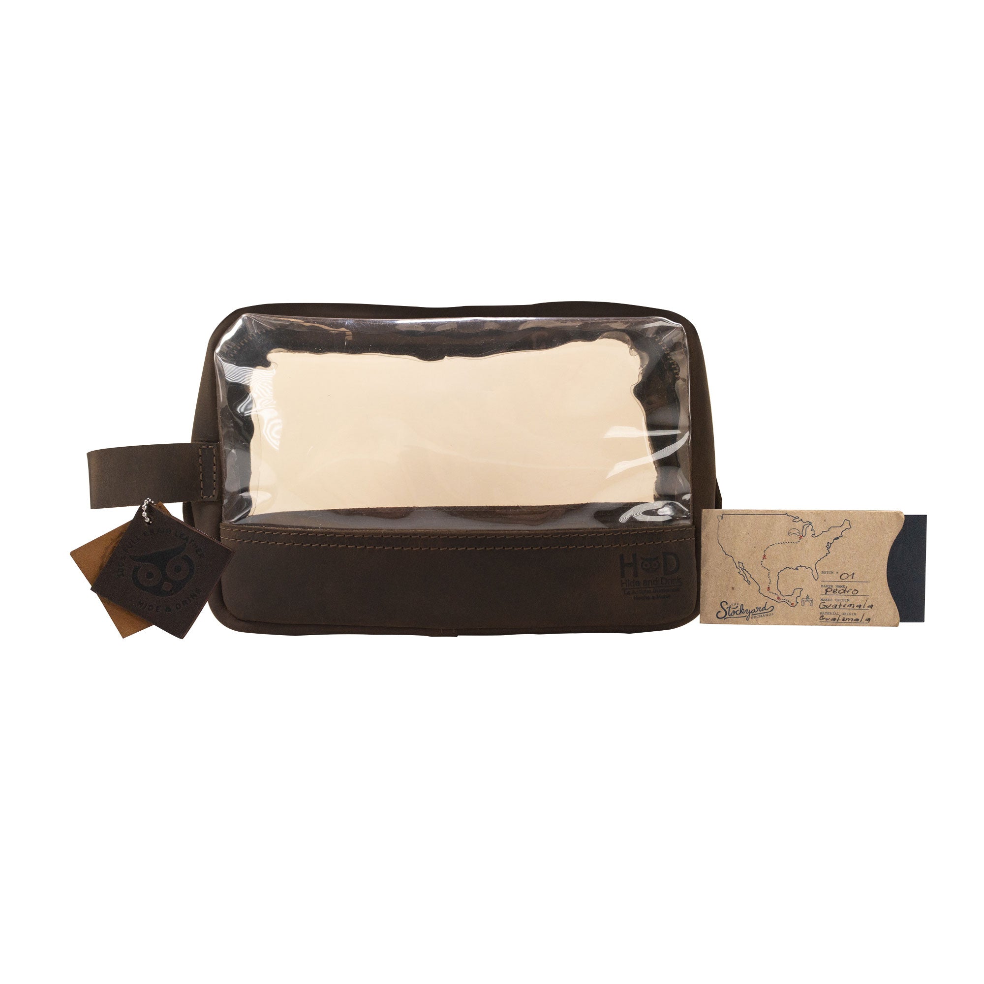 Hide & Drink Transparent Bag for Makeup with its tags and branding visible, showcasing quality materials and design, a perfect travel organizer pouch made of Full Grain Leather, emphasizing small batch production and artisan craftsmanship from La Antigua Guatemala & Oaxaca Mexico.