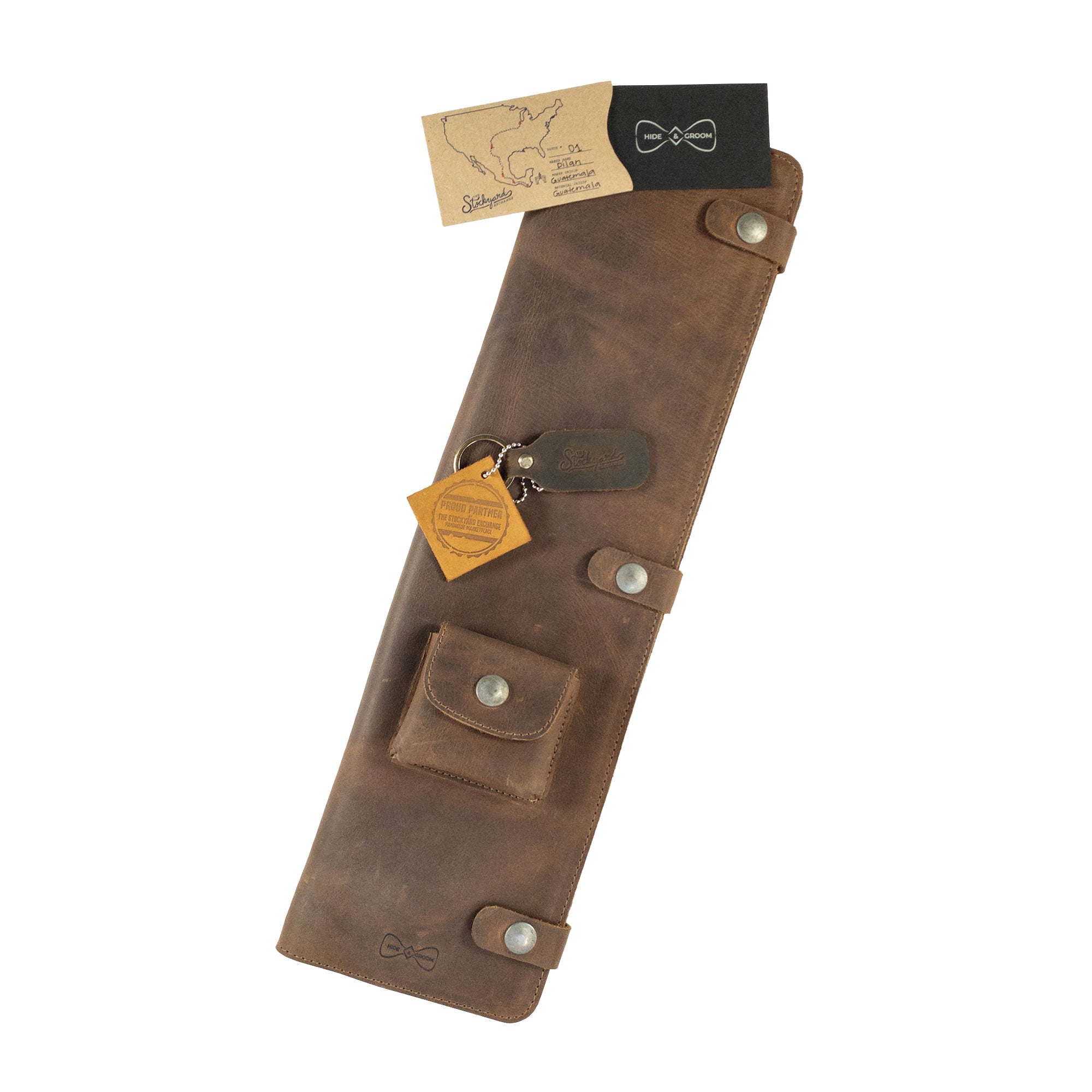 Travel Tie Case by Hide & Groom, featuring packaging and tags that highlight its artisan history. This stylish Travel Tie Case is perfect for groomsmen and handcrafted with care in La Antigua Guatemala & Oaxaca Mexico.