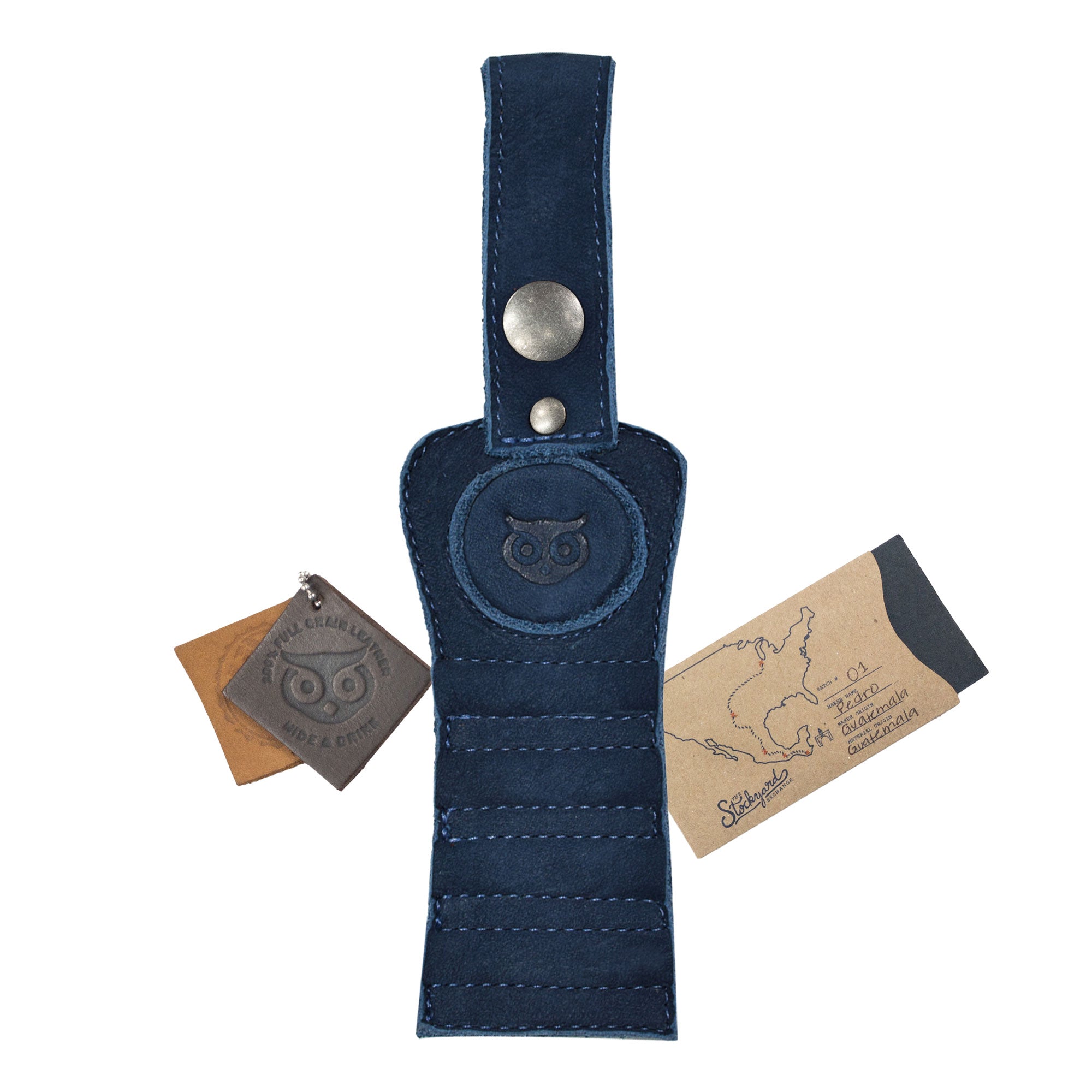 Hide & Drink Golf Tee Holder in unique blue leather with branding tags, highlighting its artisan quality. Ideal for golfers, this accessory is designed for convenient tee storage, handcrafted in La Antigua Guatemala.